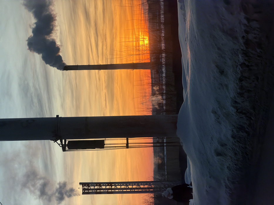 Industrial smokestacks documented at dawn in snow-covered Izhevsk