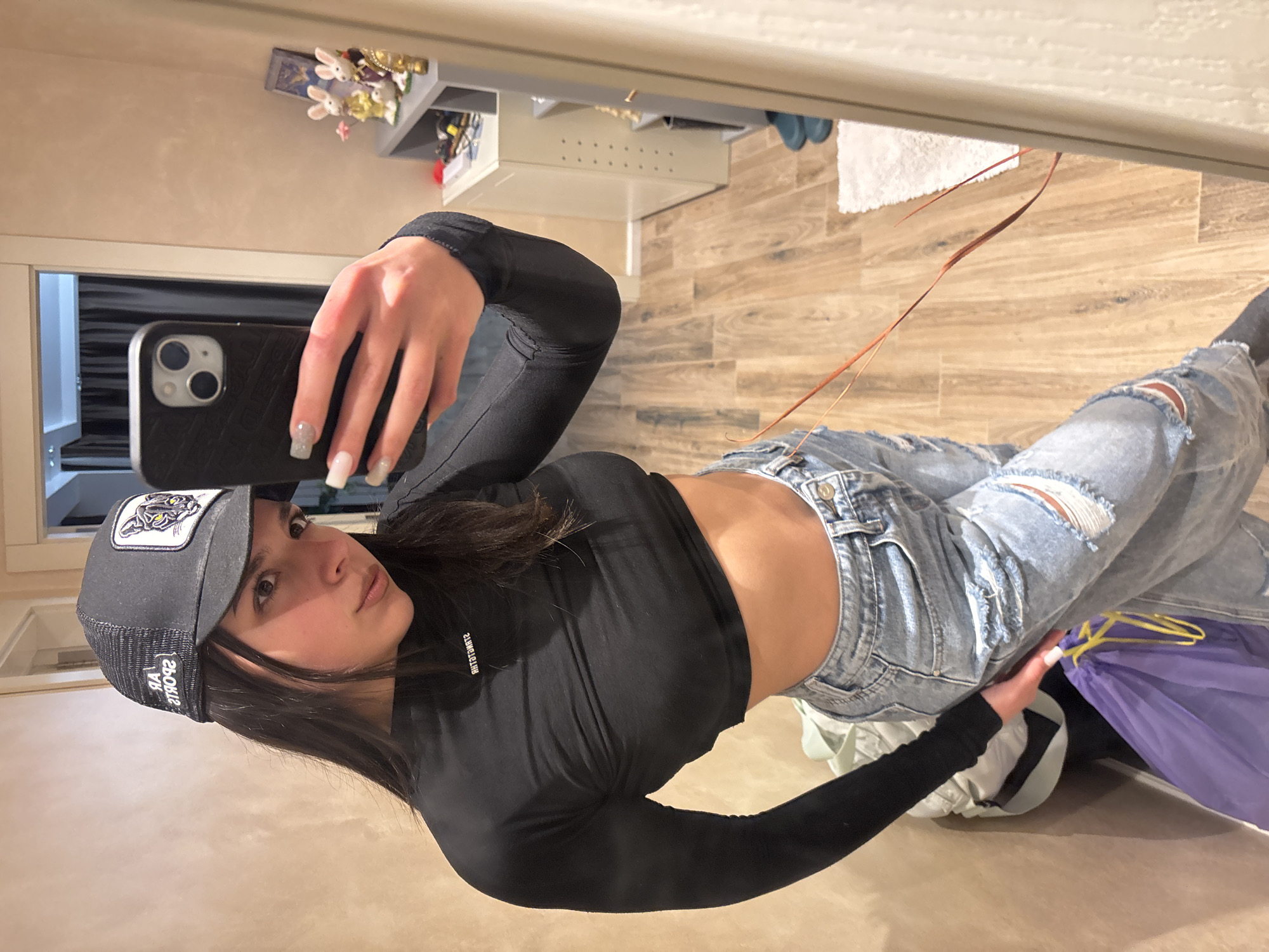 Woman takes mirror selfies at home in Gabrovo