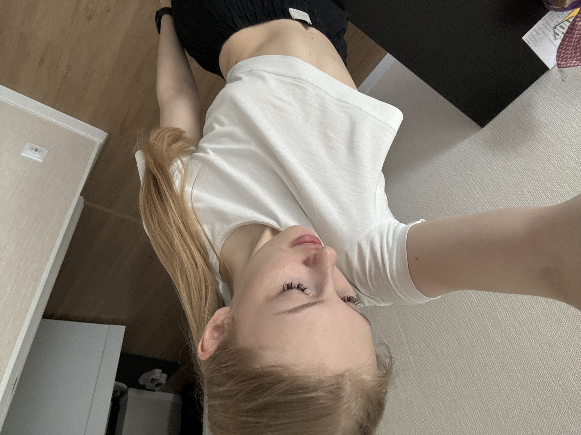 Woman documents breakfast selfie and toast preparation in Perm