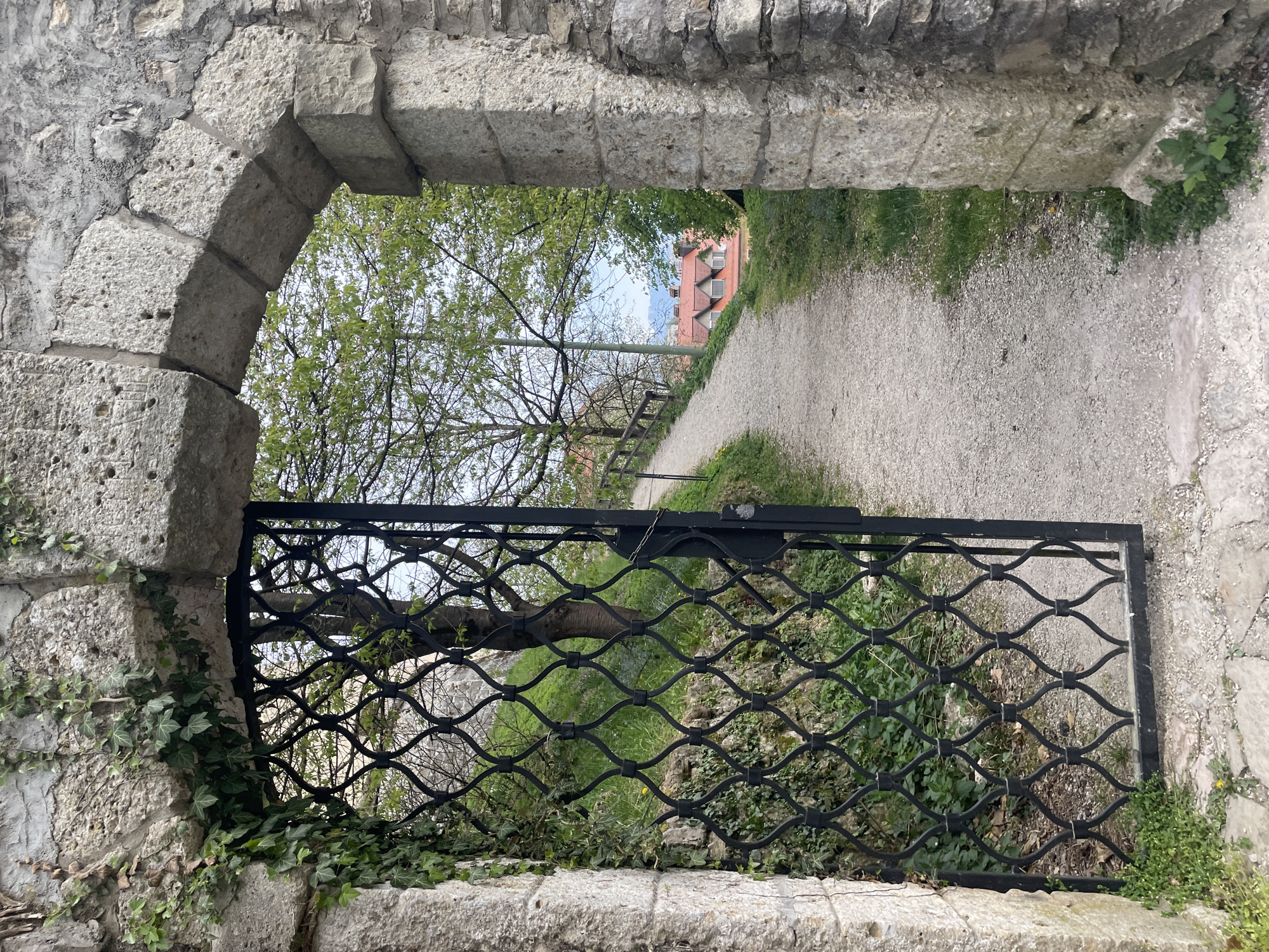 Tourist documents historic Škofja Loka landmarks during morning walk