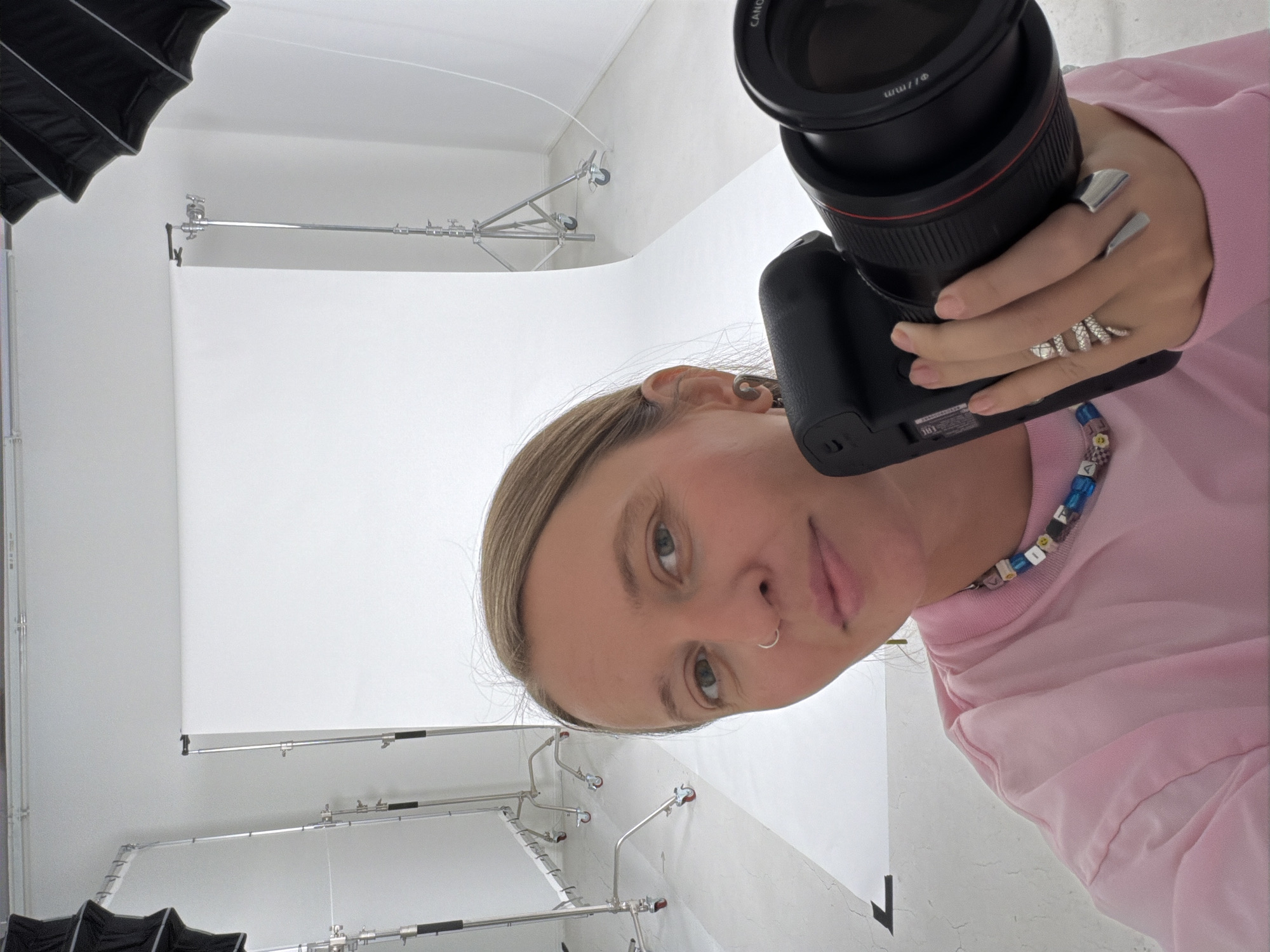 Woman takes selfie in Los Angeles photography studio