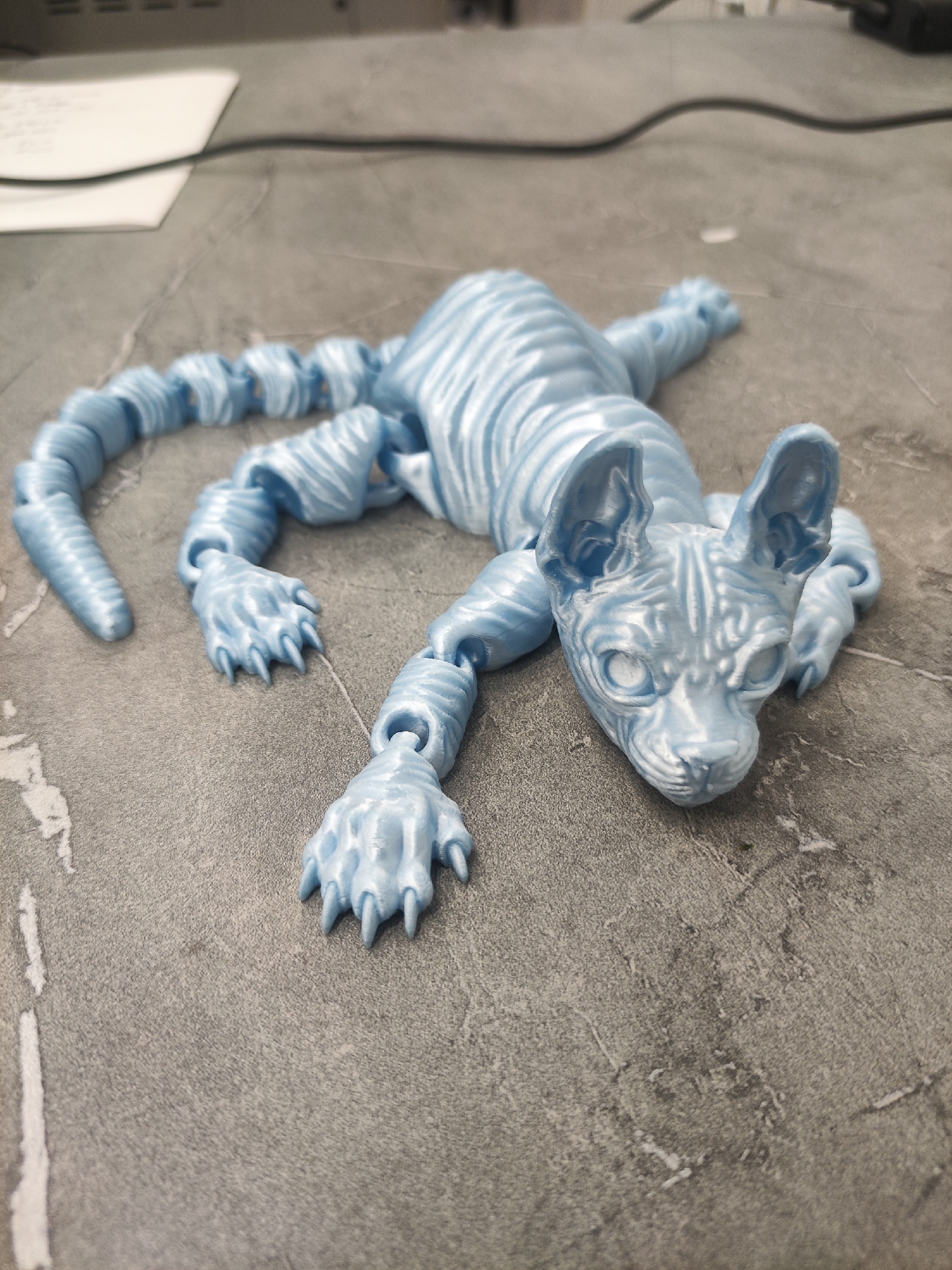 3D-printed figures fresh off the machine in a Tashkent workshop