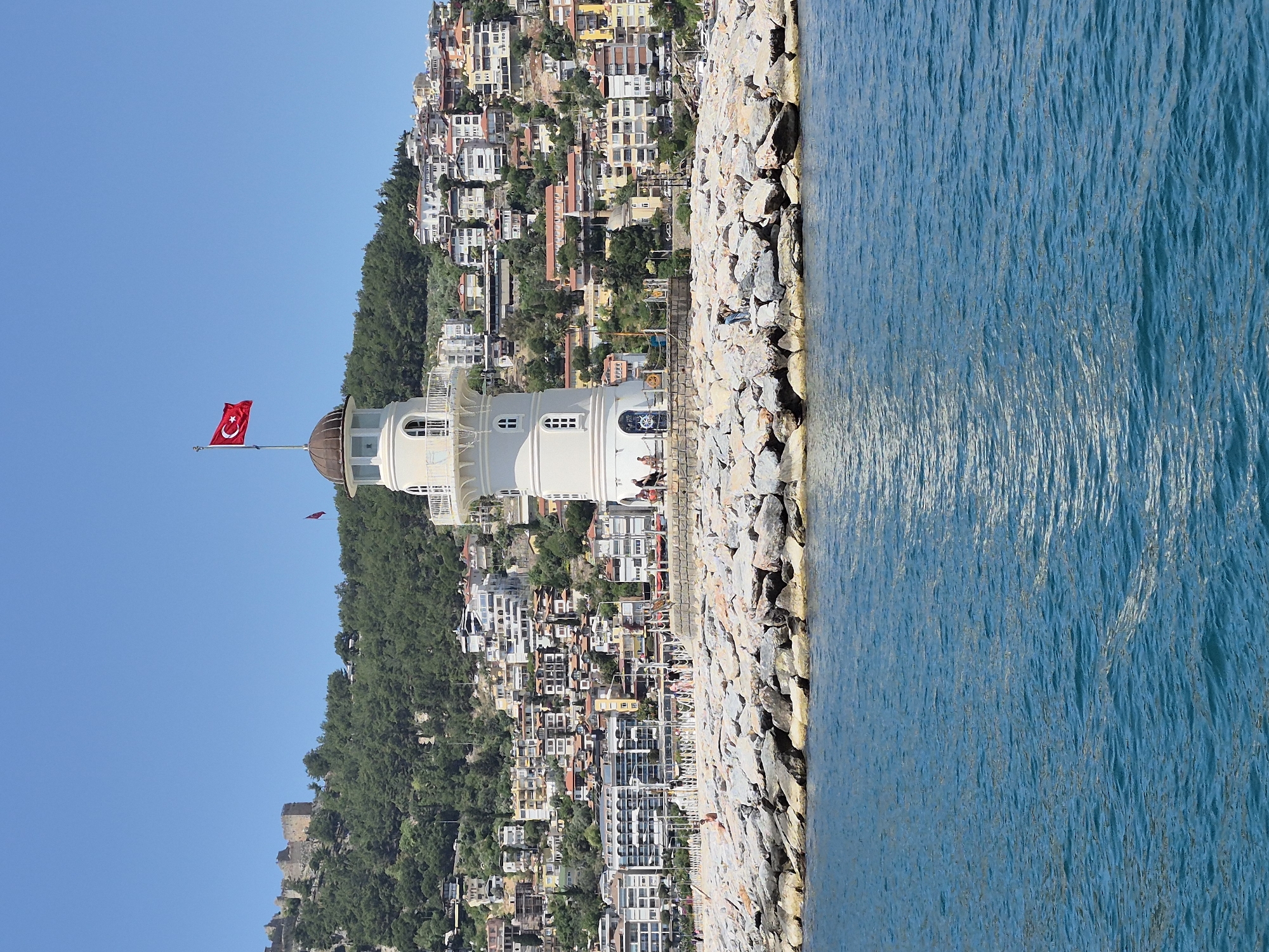 Tourist boats active in Alanya harbor during morning hours