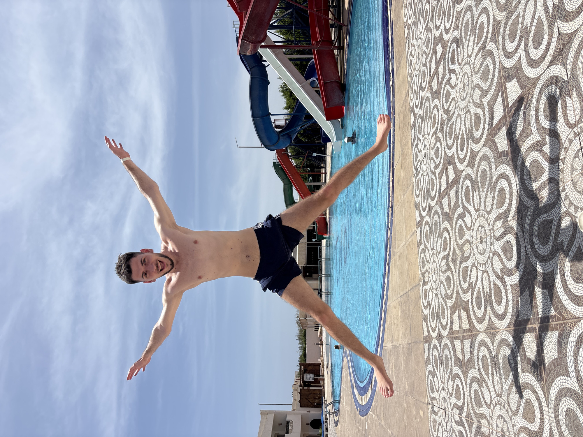 Couple enjoys pool day at water park resort