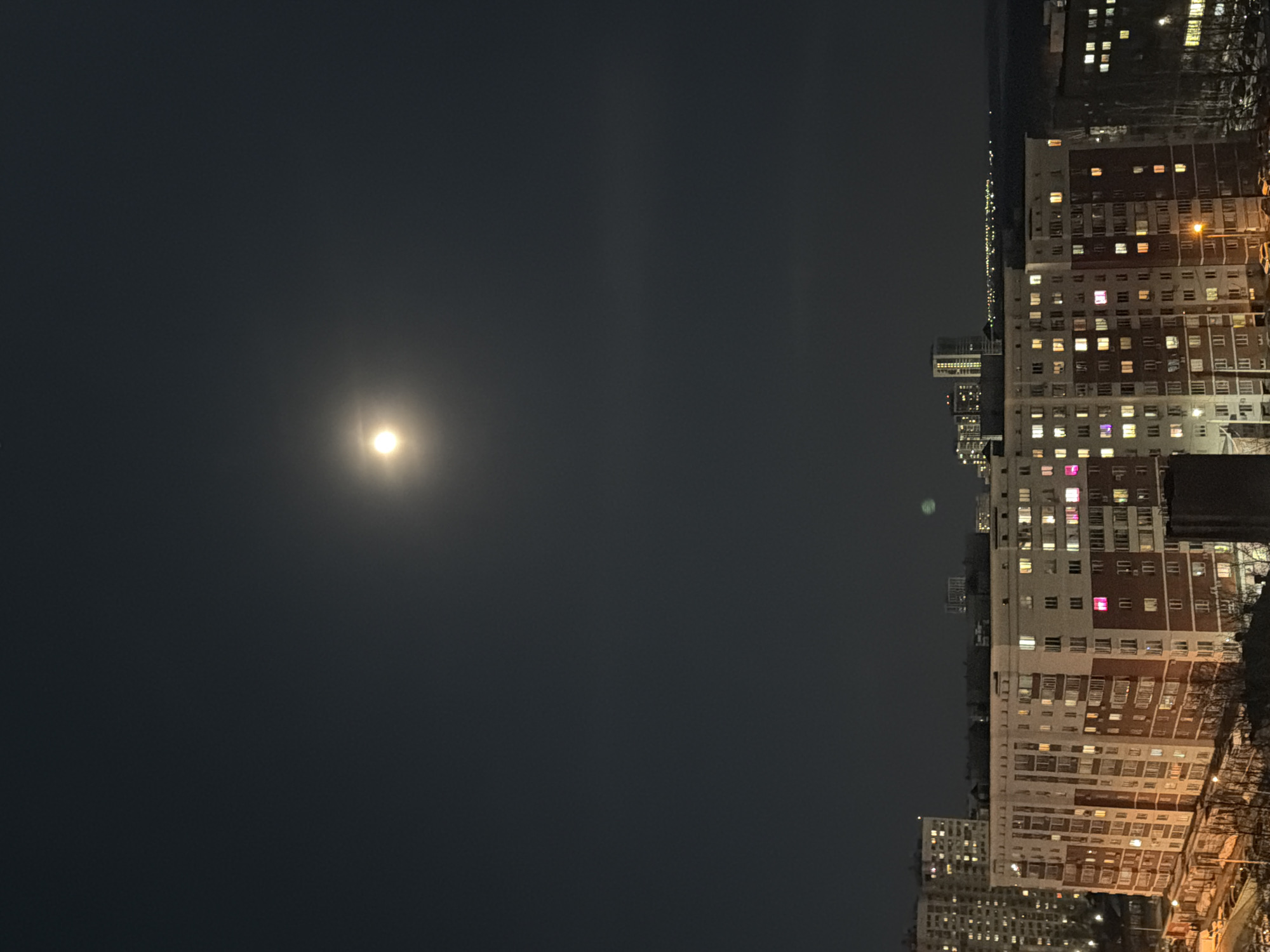 Moonlit night scene over residential apartments in Izhevsk