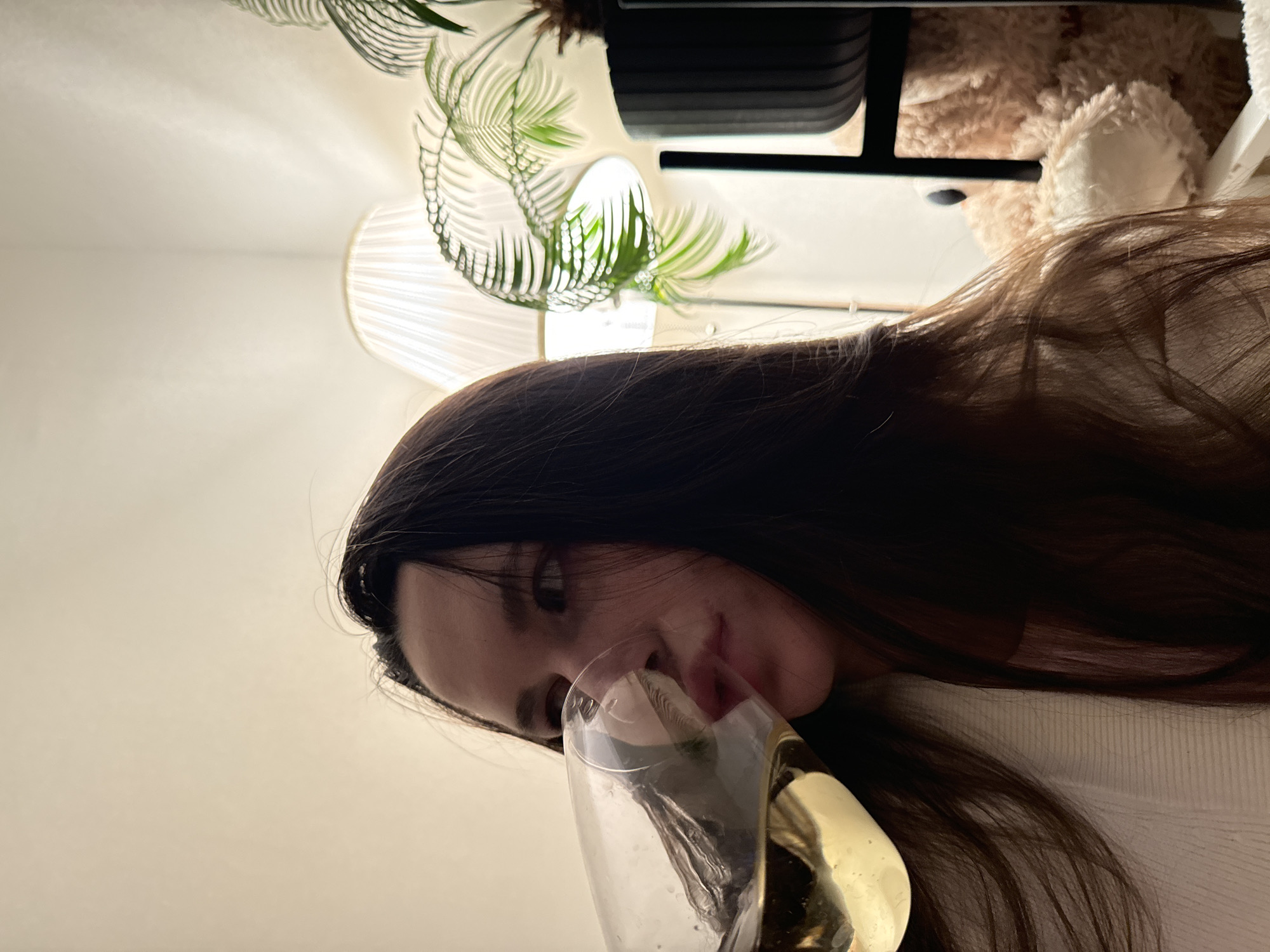 Woman enjoys wine at home in Odintsovo evening