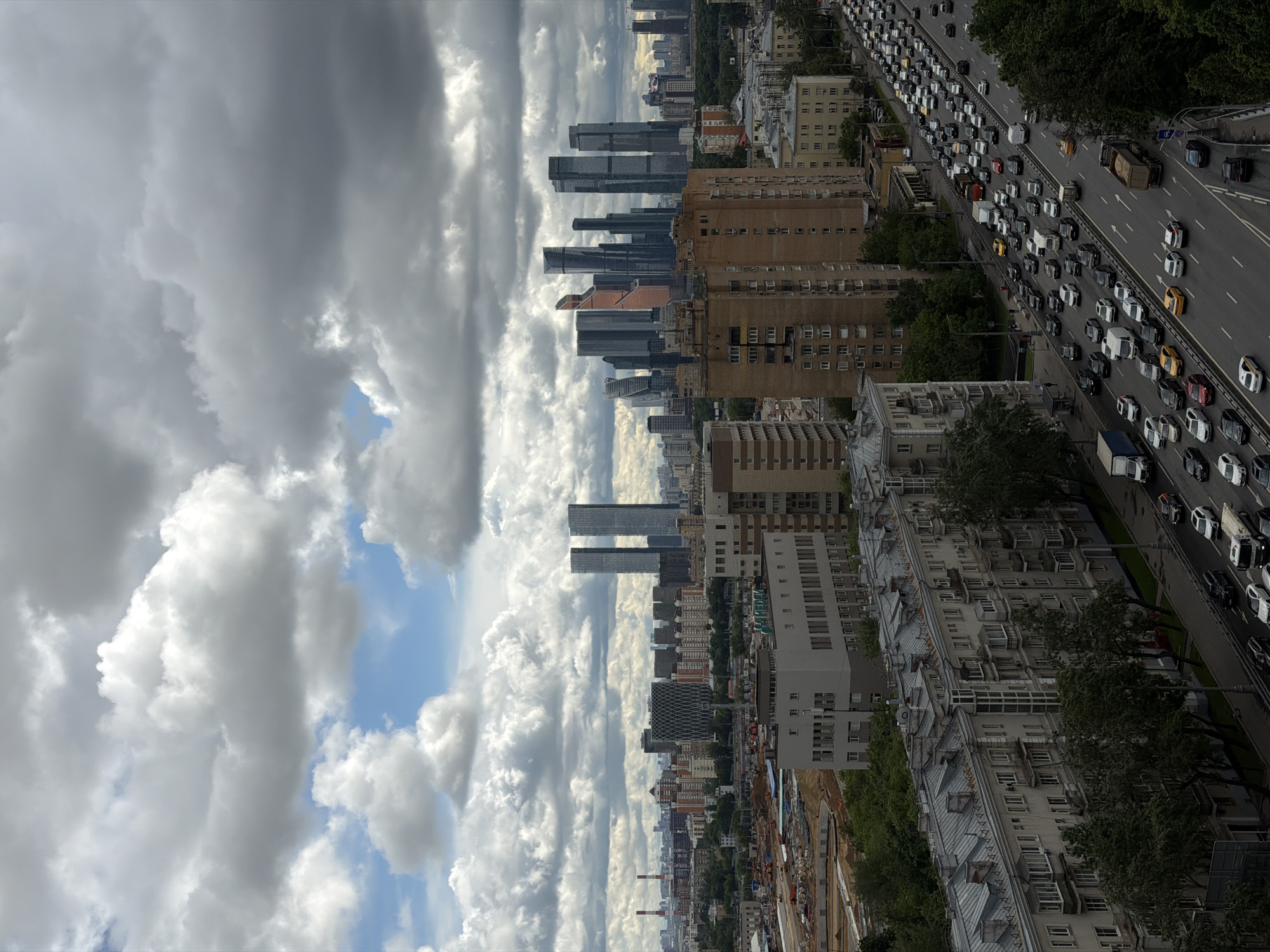 Storm clouds gather over Moscow skyline near Triumph Palace