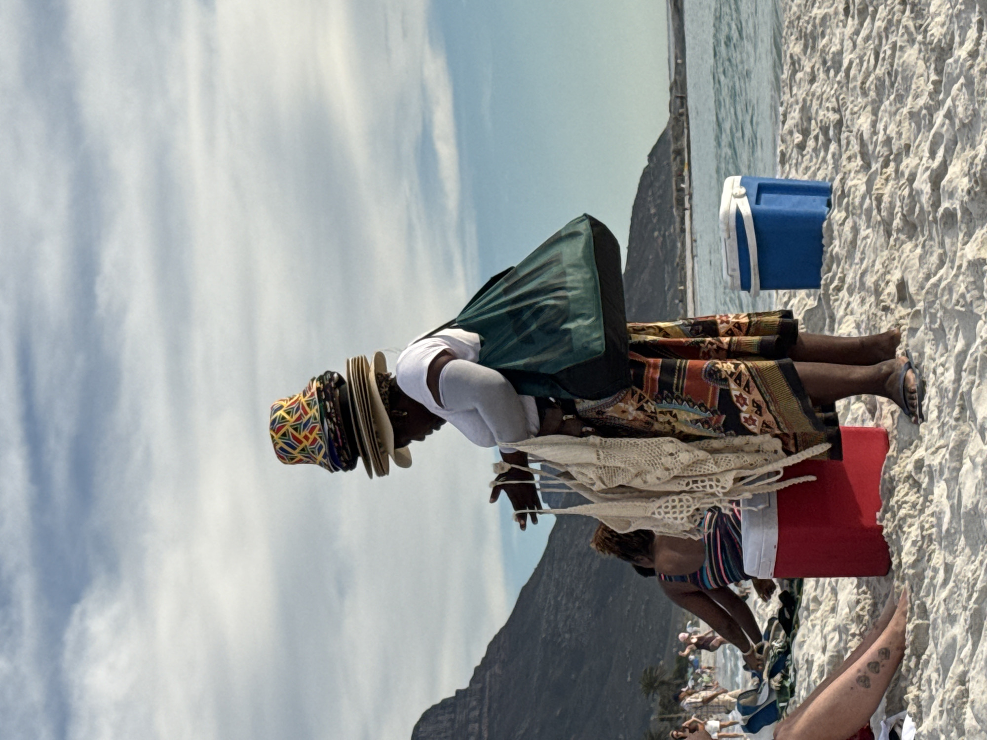 Beachgoers jog and play in Cape Town waters