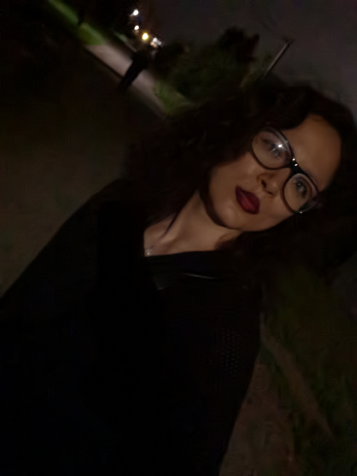 Nighttime portrait in Chaikovsky, glasses and dark lipstick.