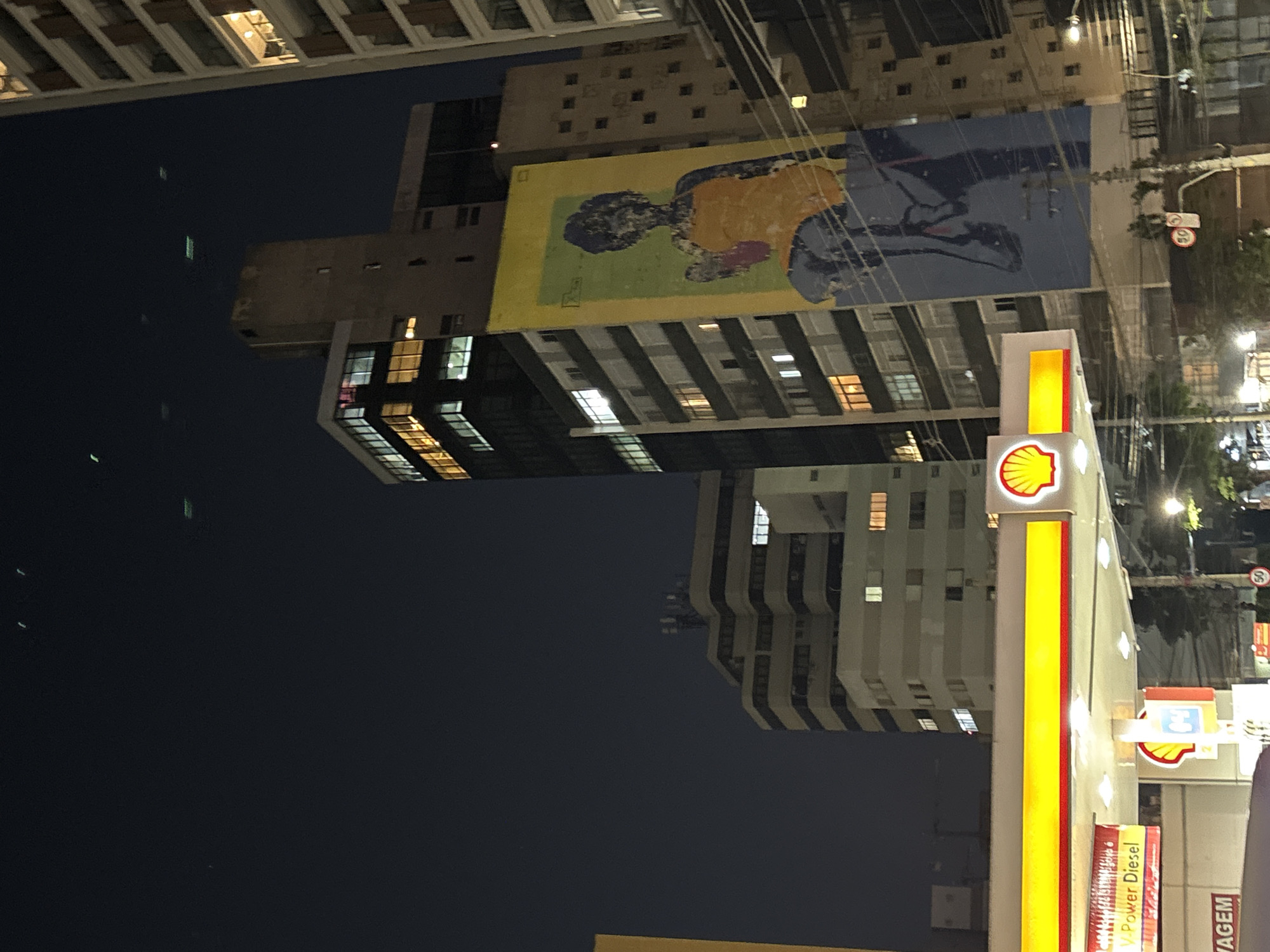 São Paulo night streets: gas stations, murals, and a bike shop
