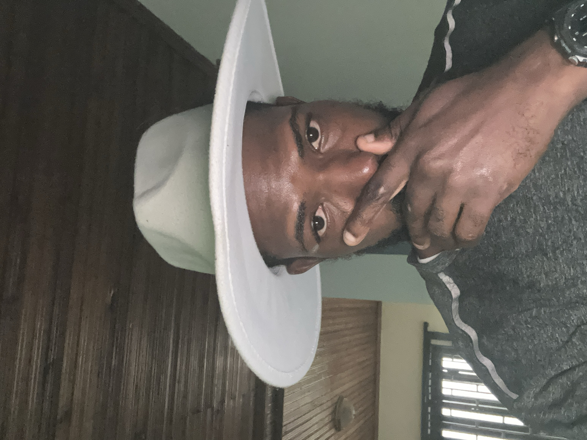 Hat styling, a relaxed kid, and Lagos street scenes