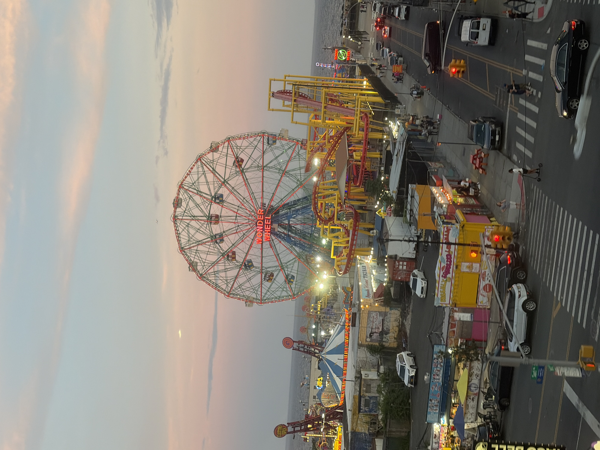Coney Island lights up at dusk, July 2026