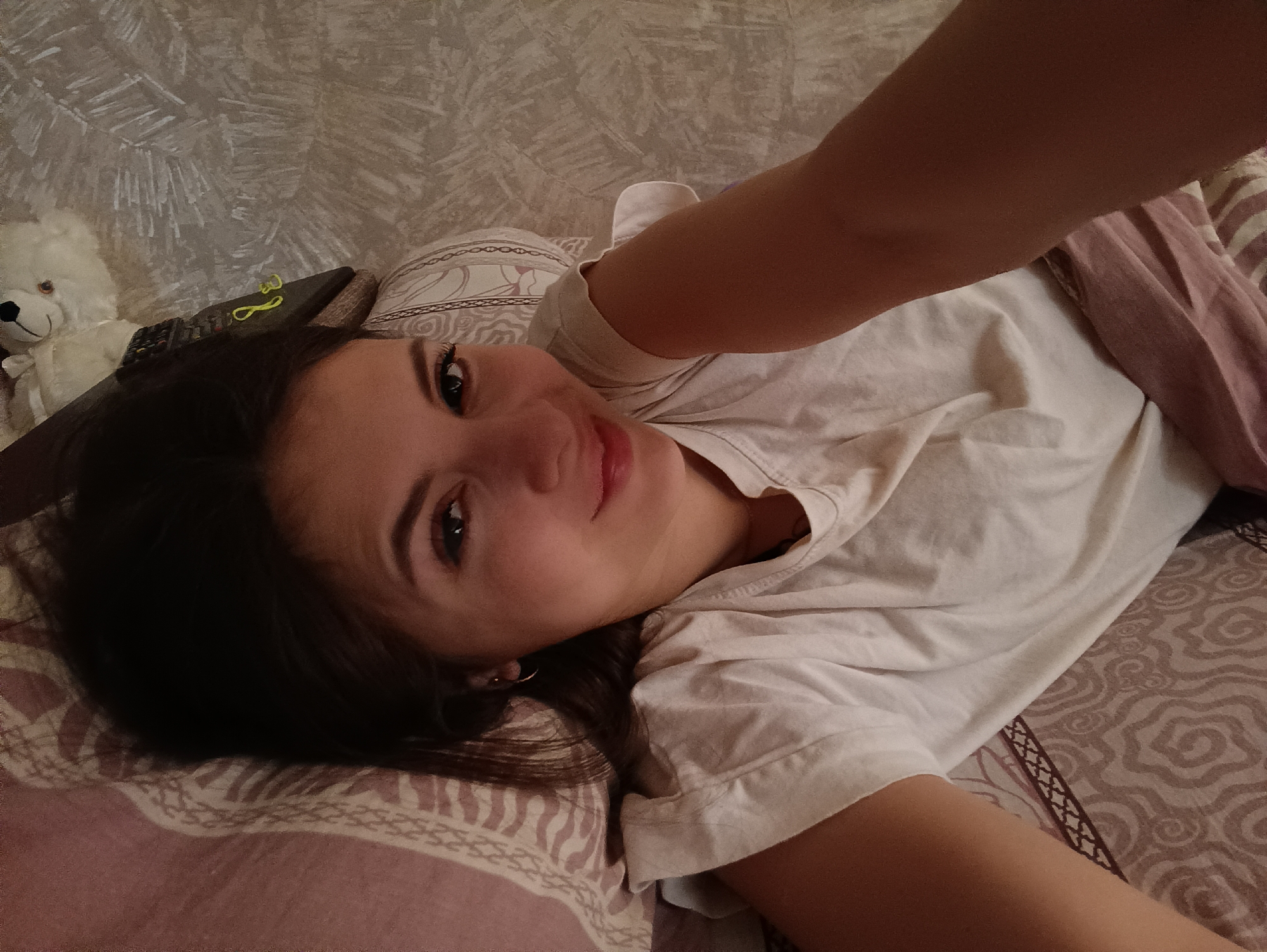 Woman rests in bedroom during morning hours in Chaikovsky