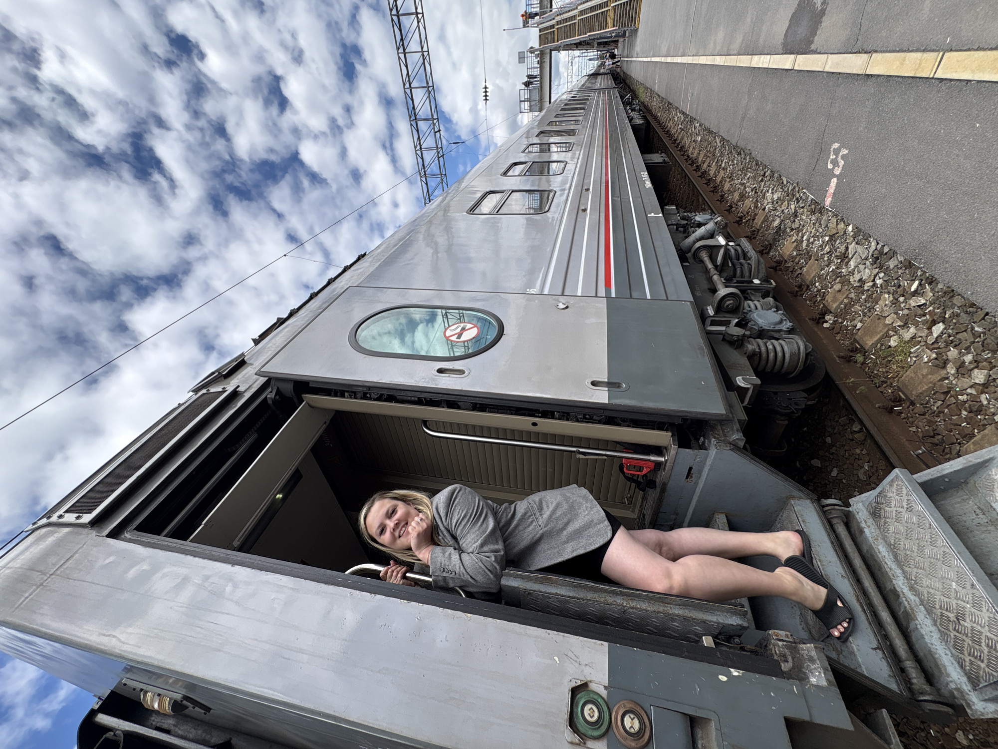 Woman photographs herself at train station in Rostov-on-Don
