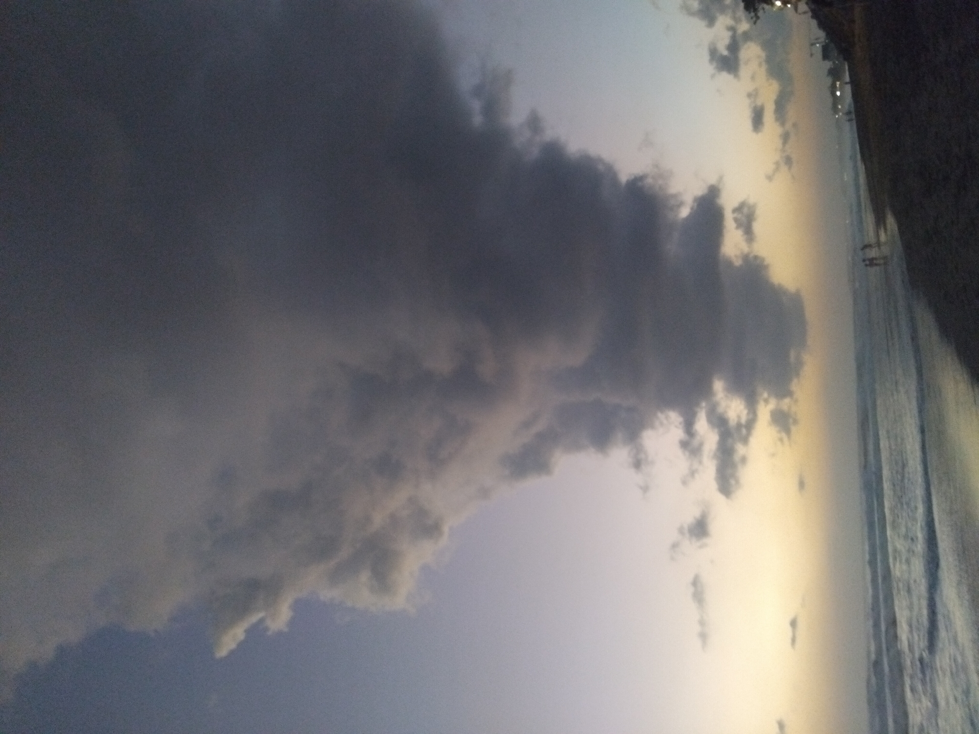 Dramatic sunset with storm clouds witnessed at North Kuta beach