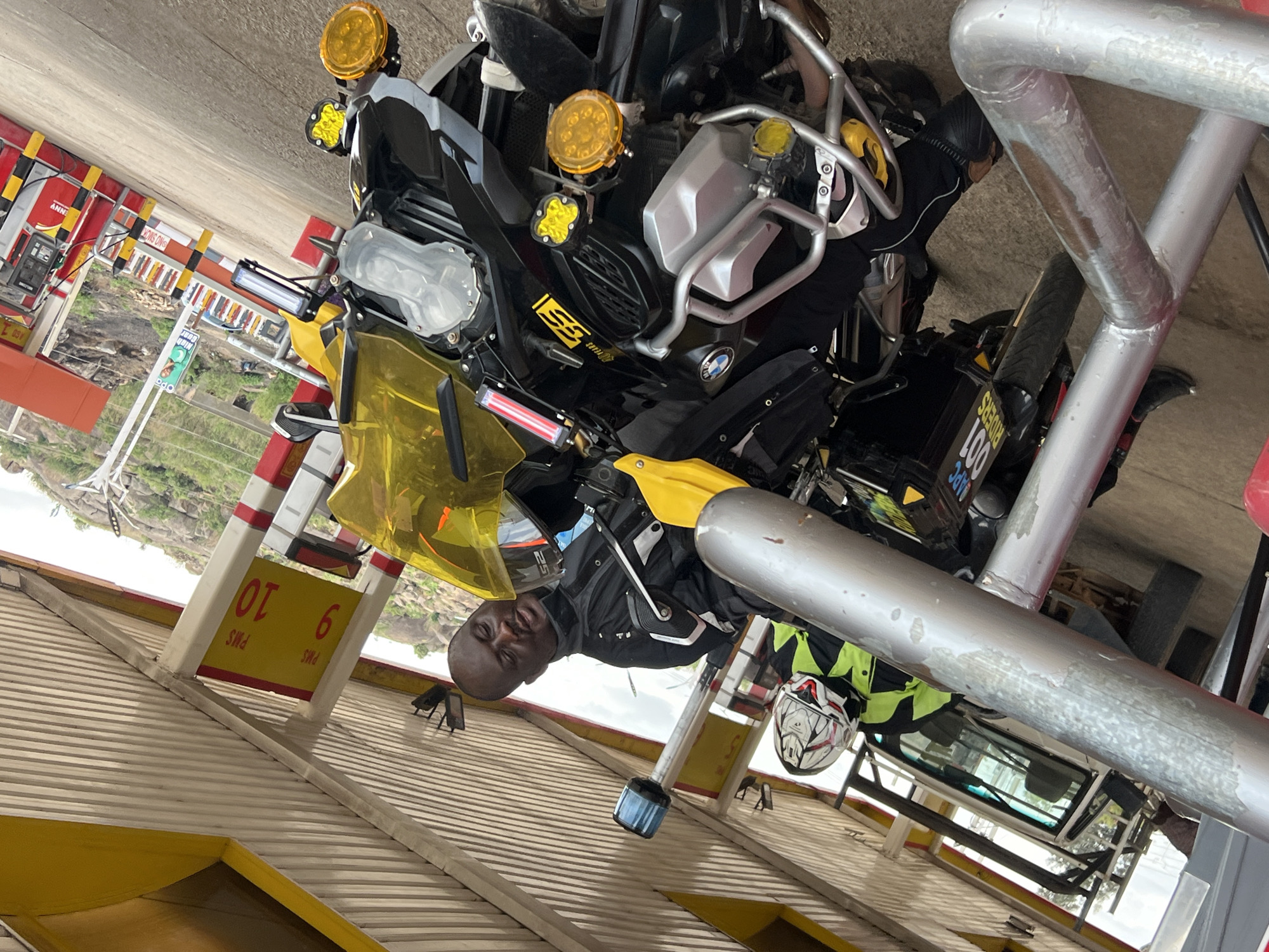 BMW motorcyclist makes routine fuel stop at Nigerian gas station