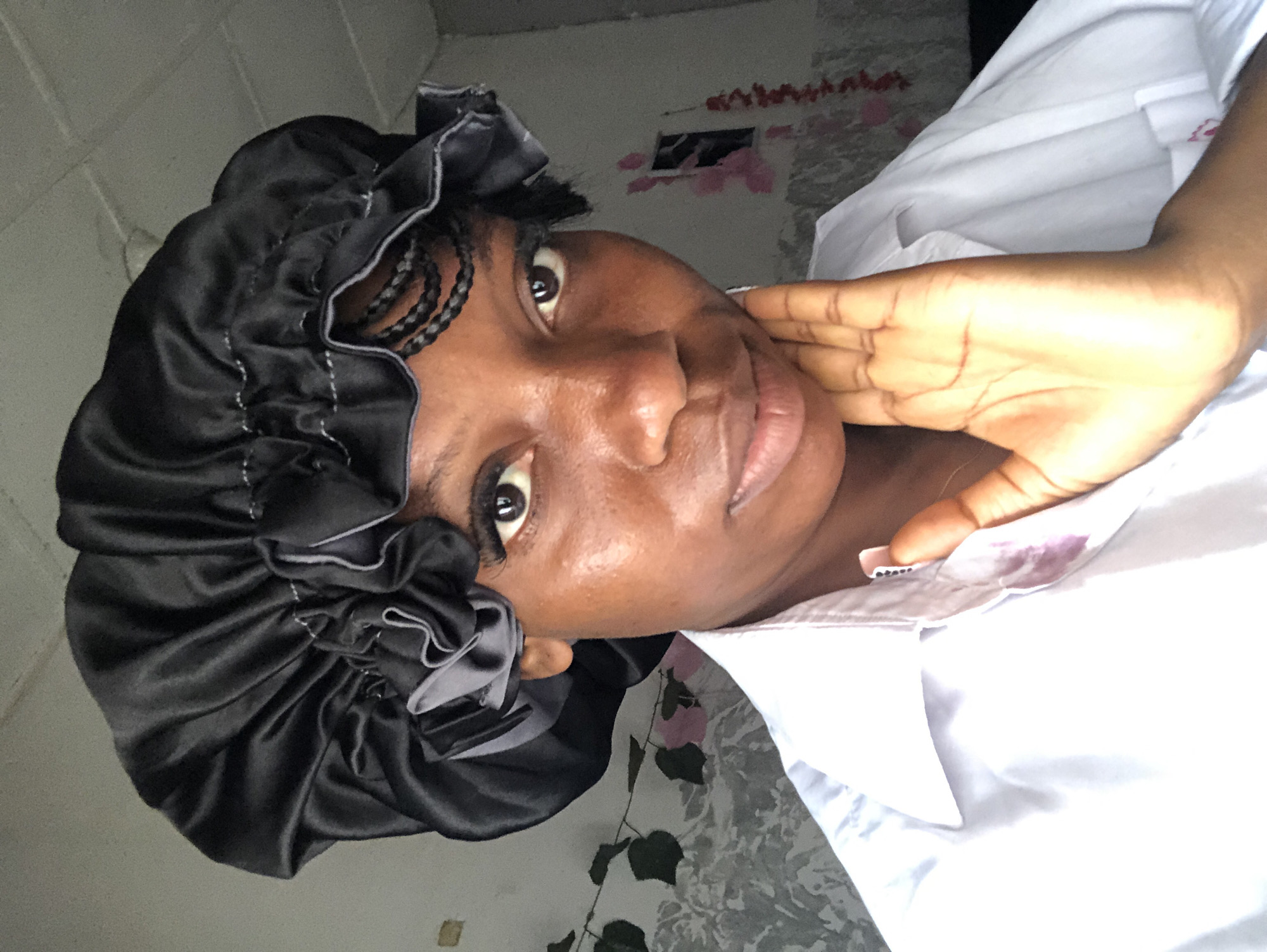 Close-up selfie series in black bonnet and white shirt