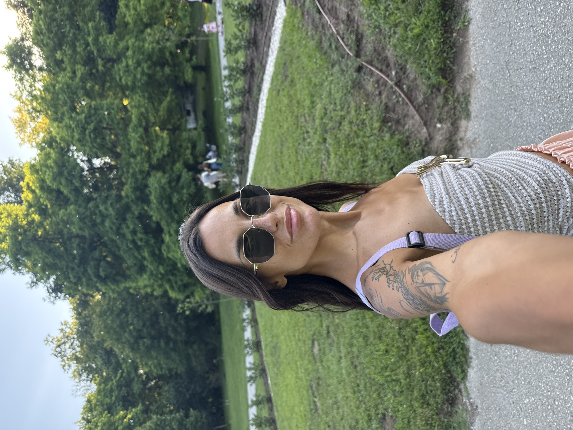 Afternoon in a Pleven park, Porsche Taycan parked nearby