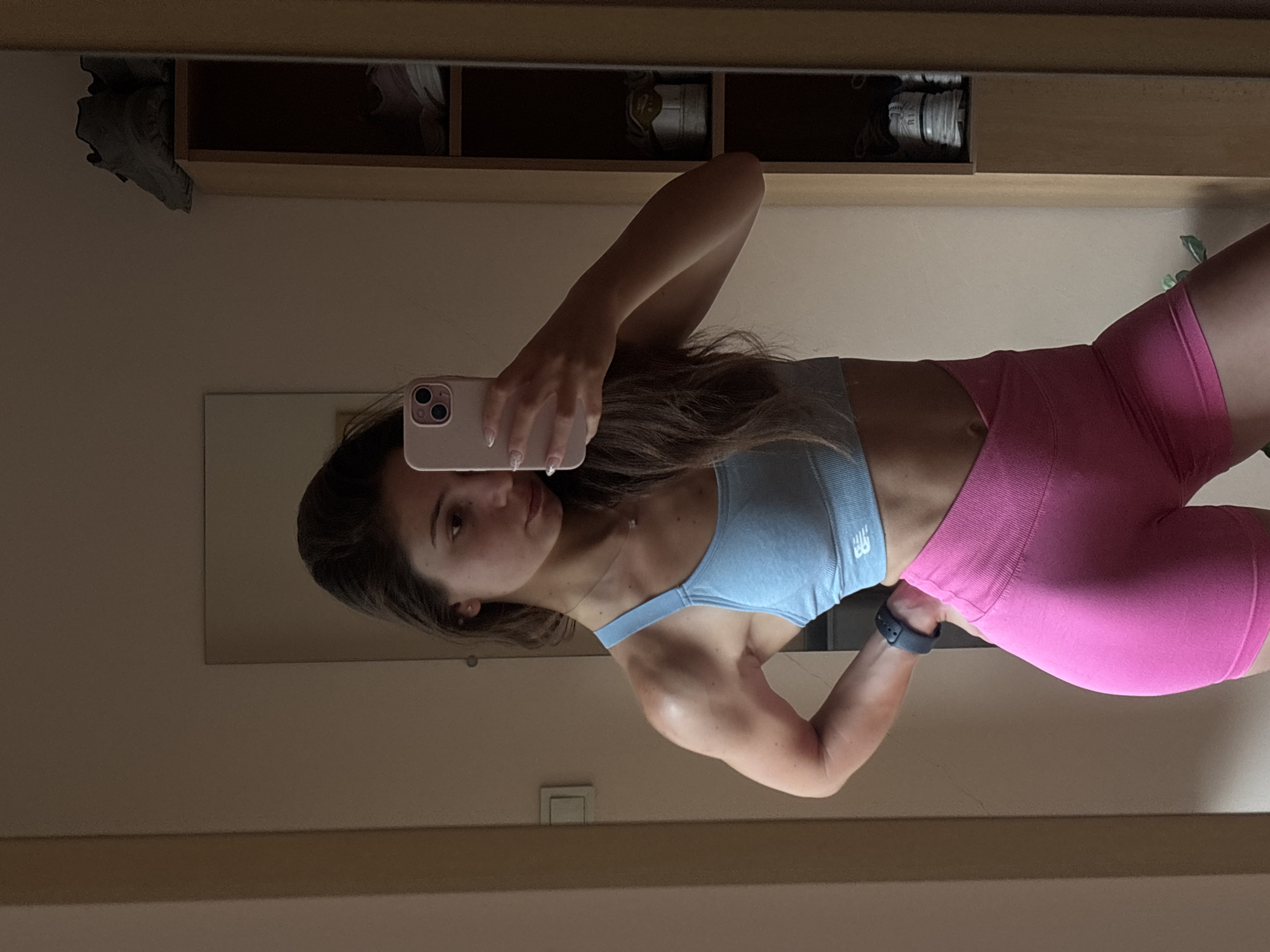 Mirror selfie in Varna bedroom, athletic outfit, July 2026