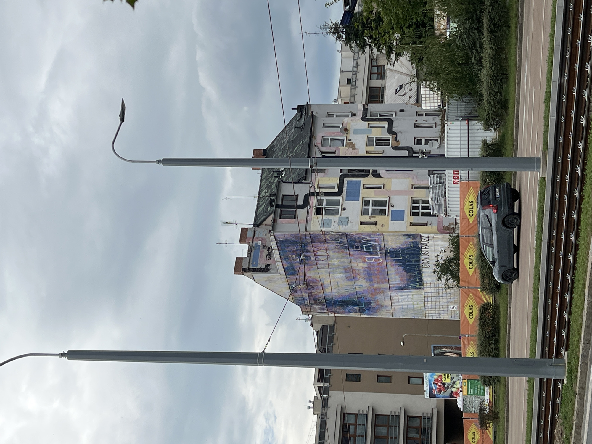 Street art and selfies around a Pilsen building mural
