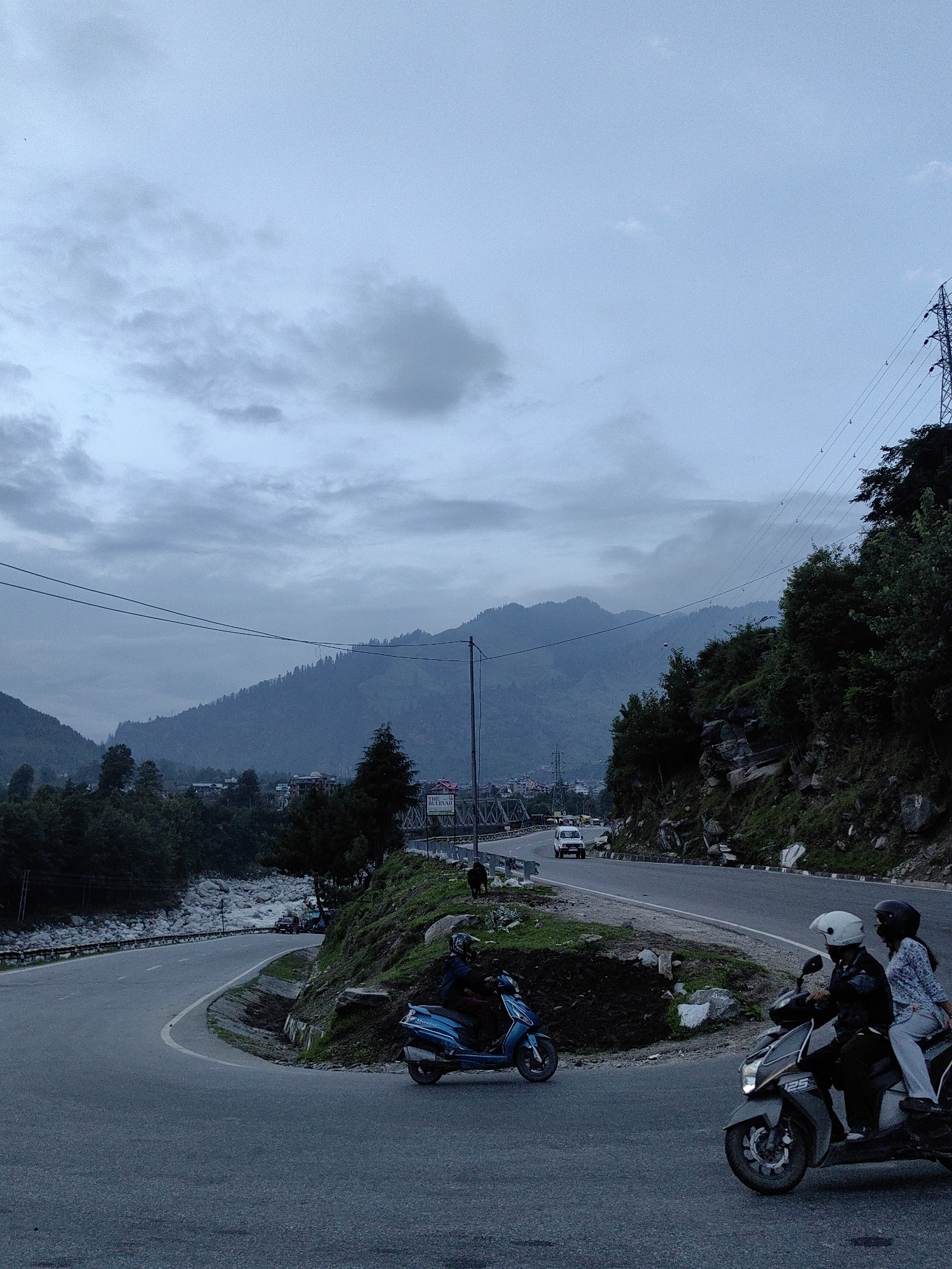 Mountain road construction and daily life in the Kullu hills