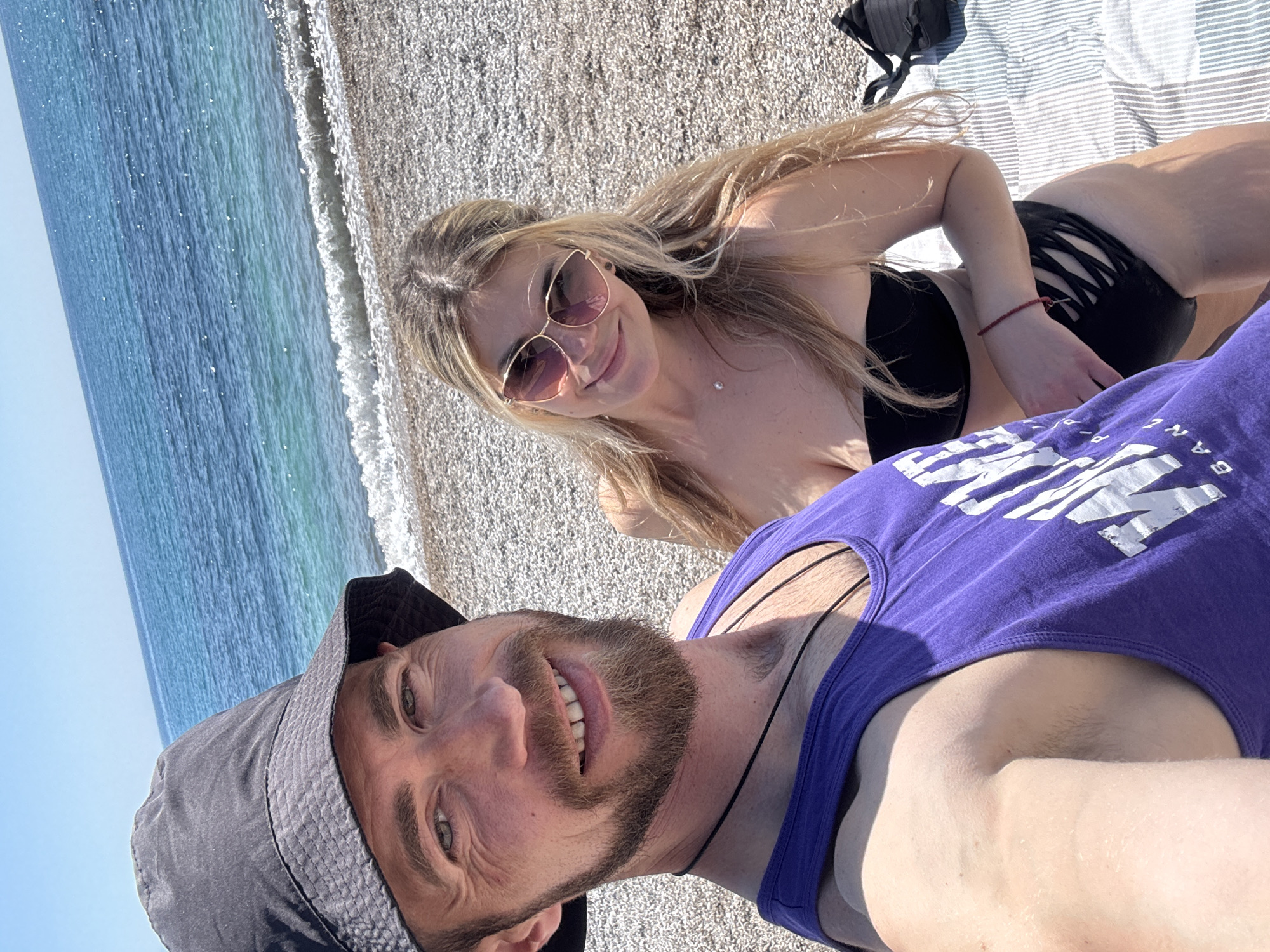 Couple enjoys sunny beach day in Prijevor, Montenegro