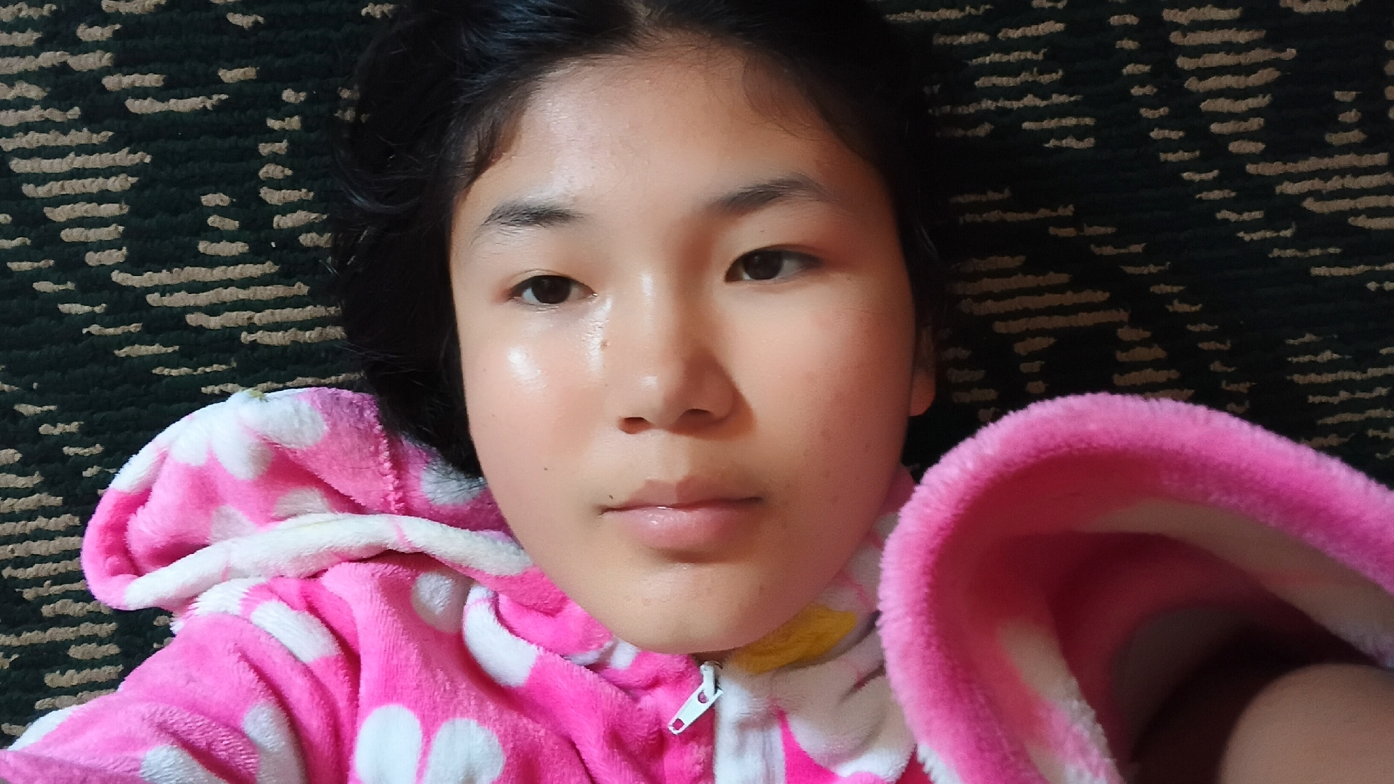 Close-up in Uchkun: pink polka-dot jacket, lying down