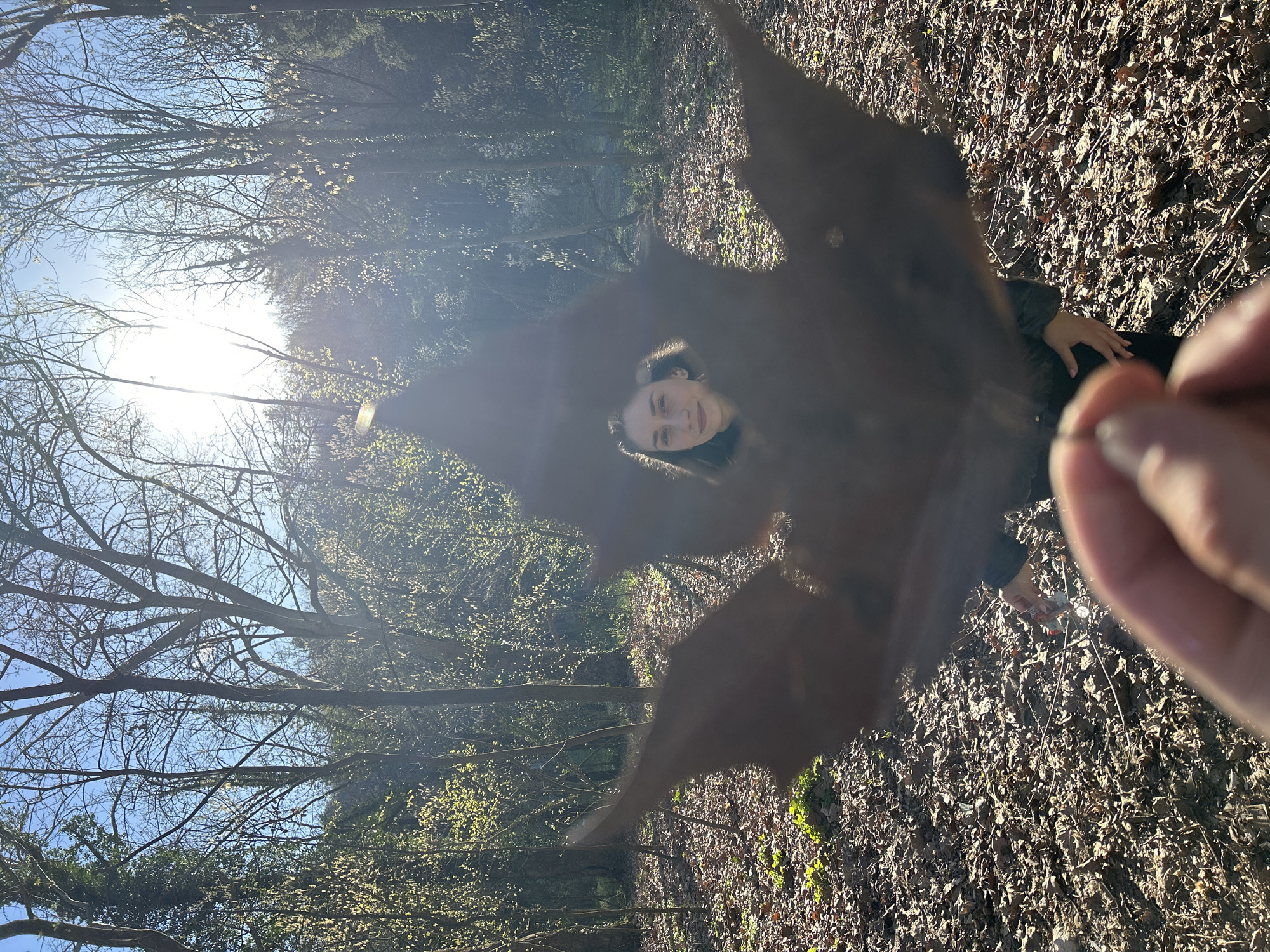 Woman photographed with leaf in wooded area, Pleven