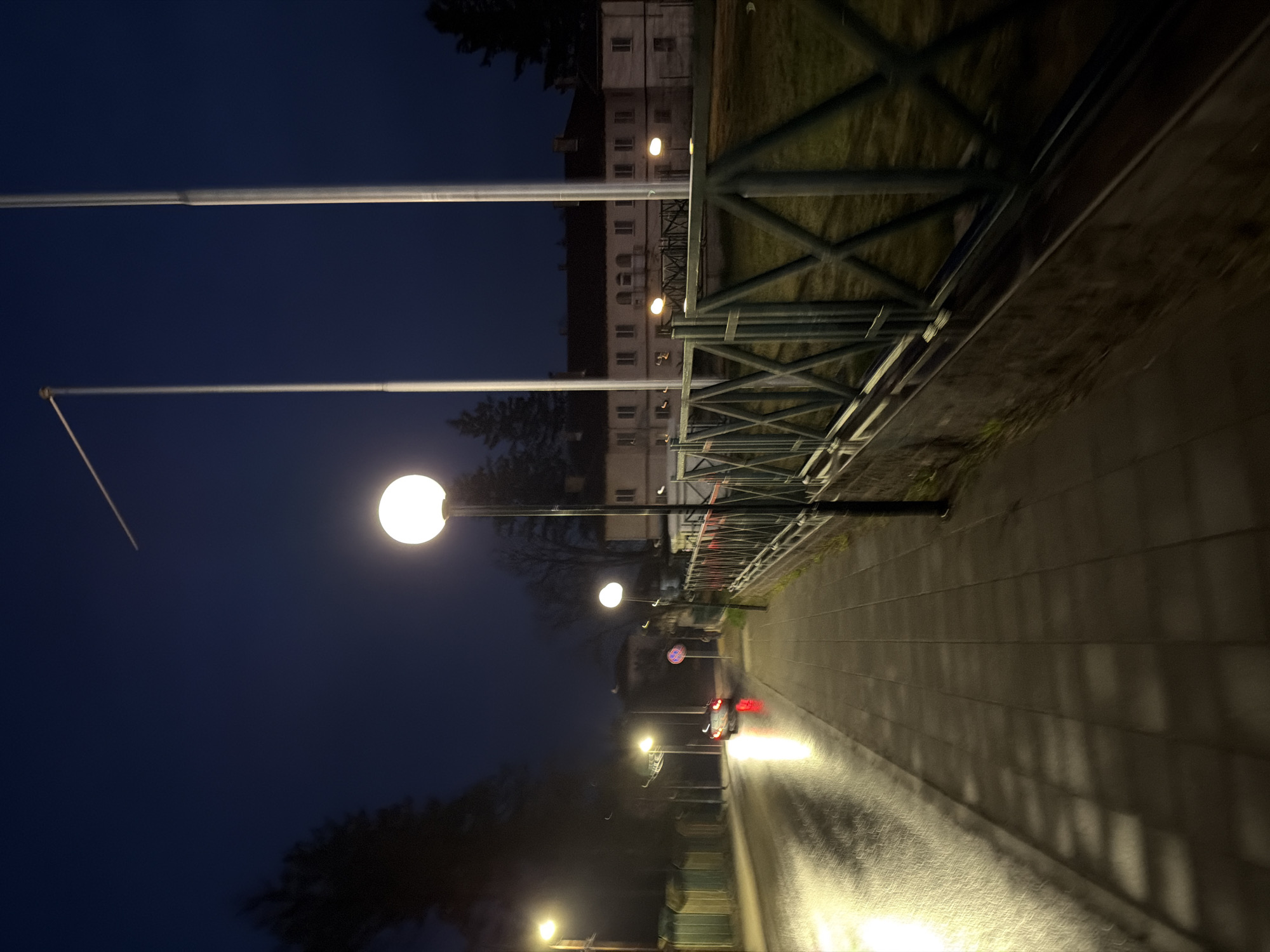 Nighttime walk documented through wet streets in Panagyurishte, Bulgaria