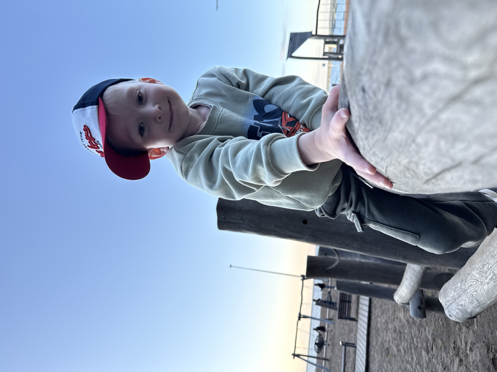 Child plays at wooden playground in Chaikovsky, Russia