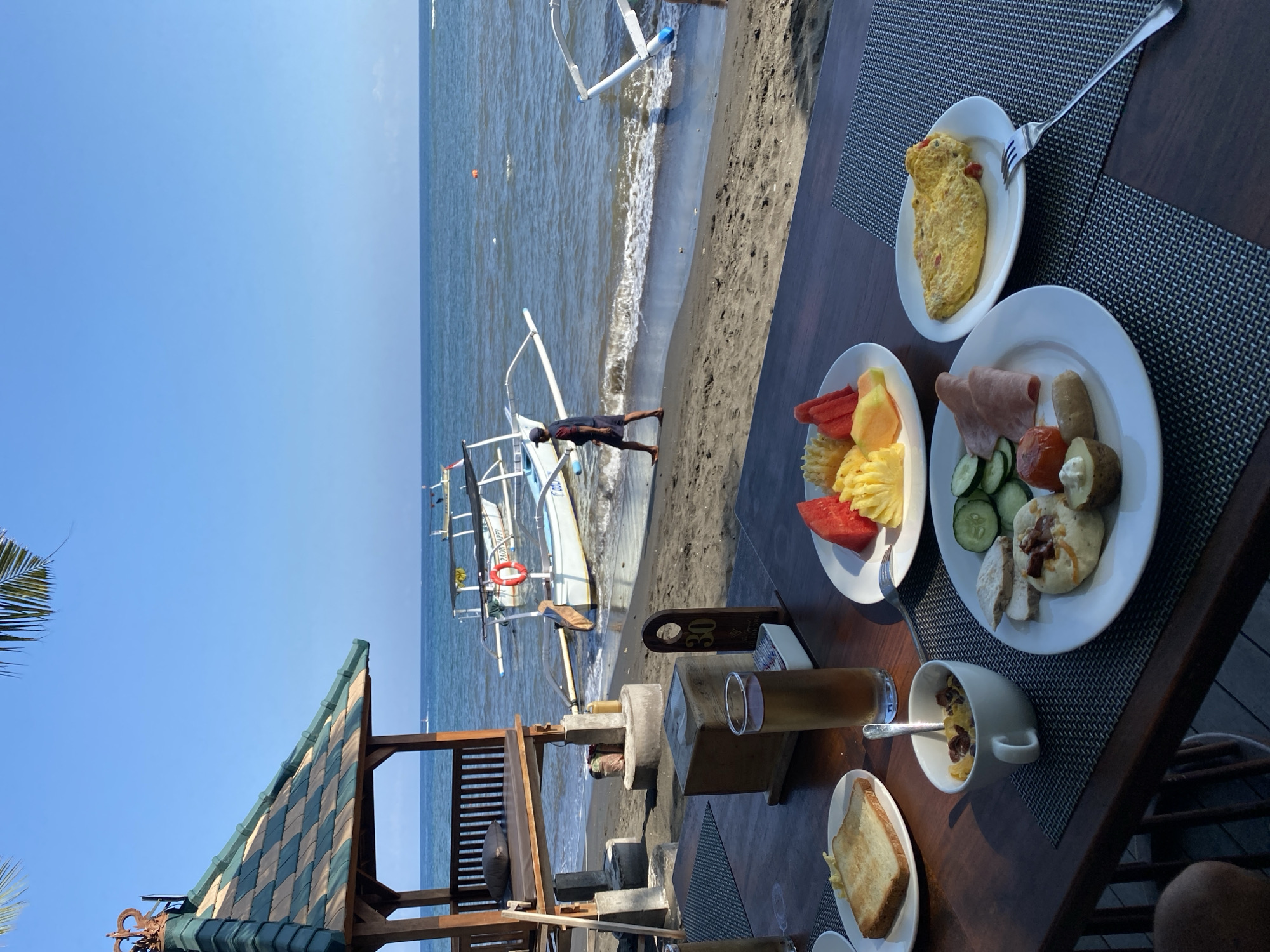 Beachfront breakfast spread in Buleleng with ocean views