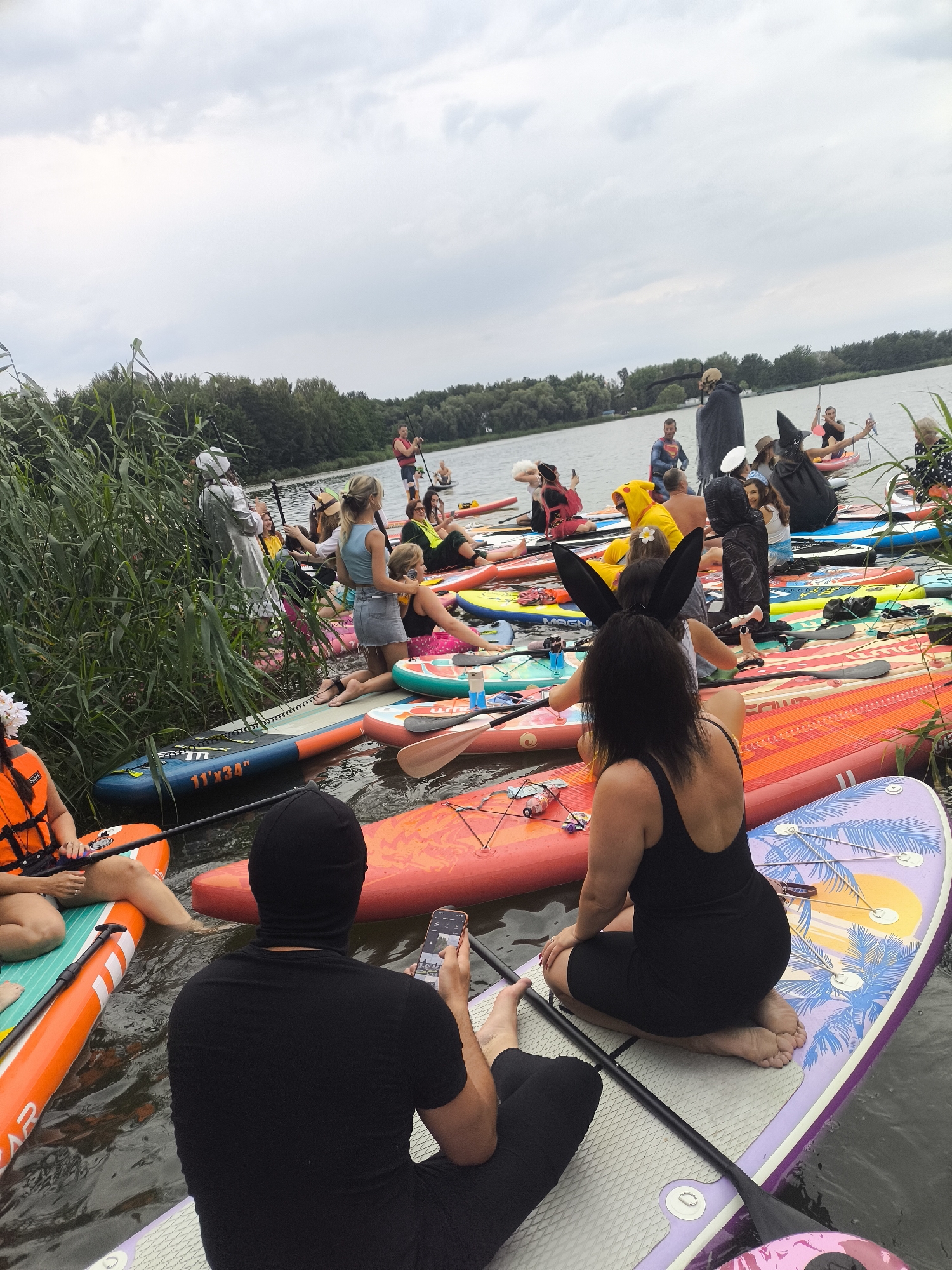 Costumed paddleboarders take over a Kaliningrad waterway