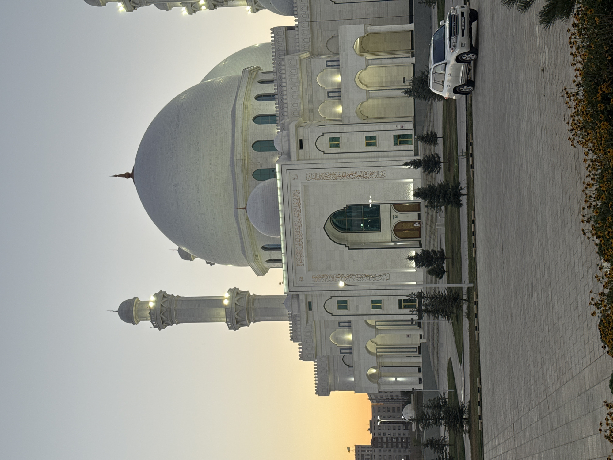 Hazret Sultan Mosque glowing under artificial lights in Shymkent