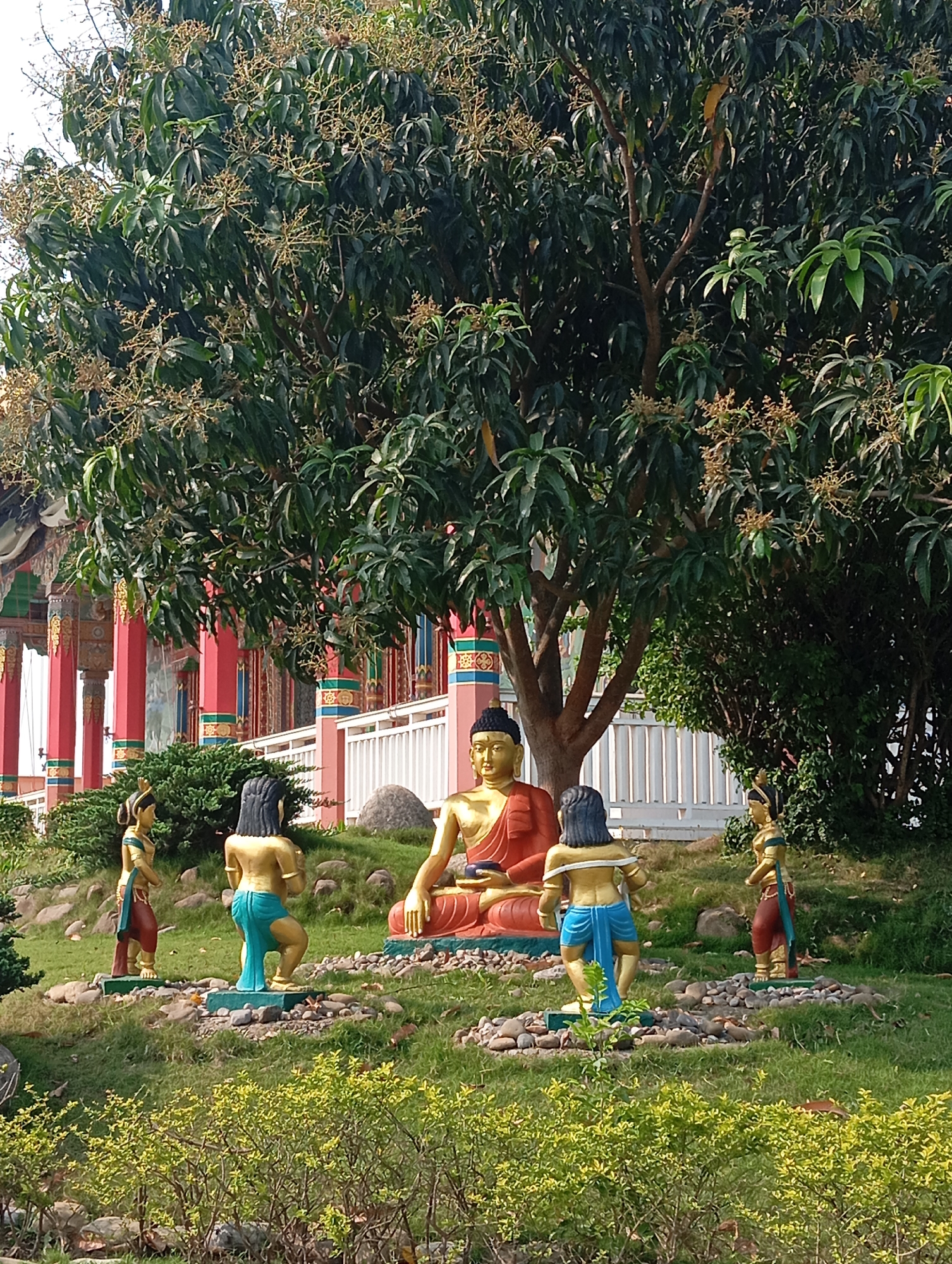 Tourist documents Buddhist temples and artwork in Lumbini, Nepal