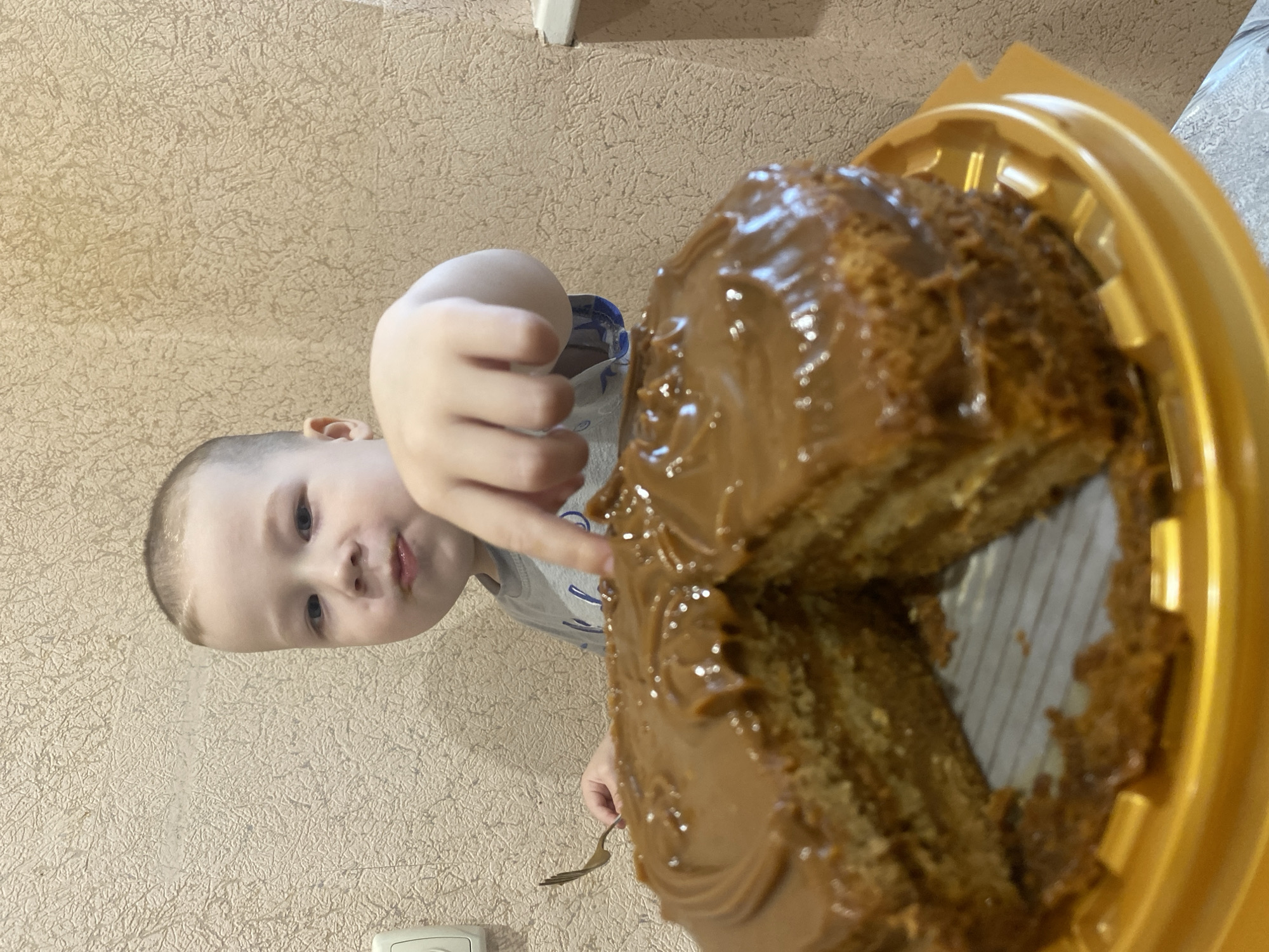 Child enjoys cake and playtime in Sochi home