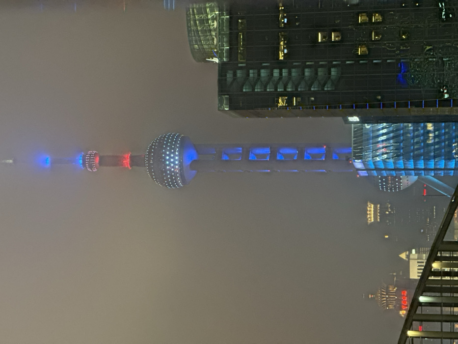 Oriental Pearl Tower emerges through dense fog in Shanghai