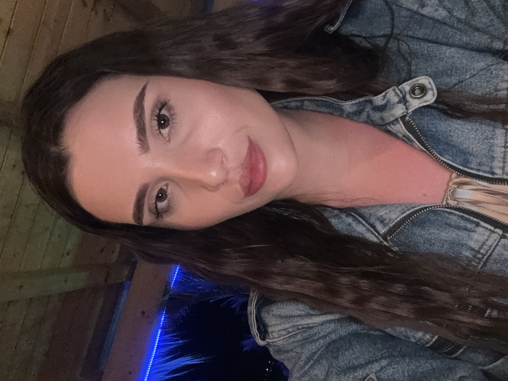 Evening selfie session at a neon-lit bar in Primorsko, Bulgaria