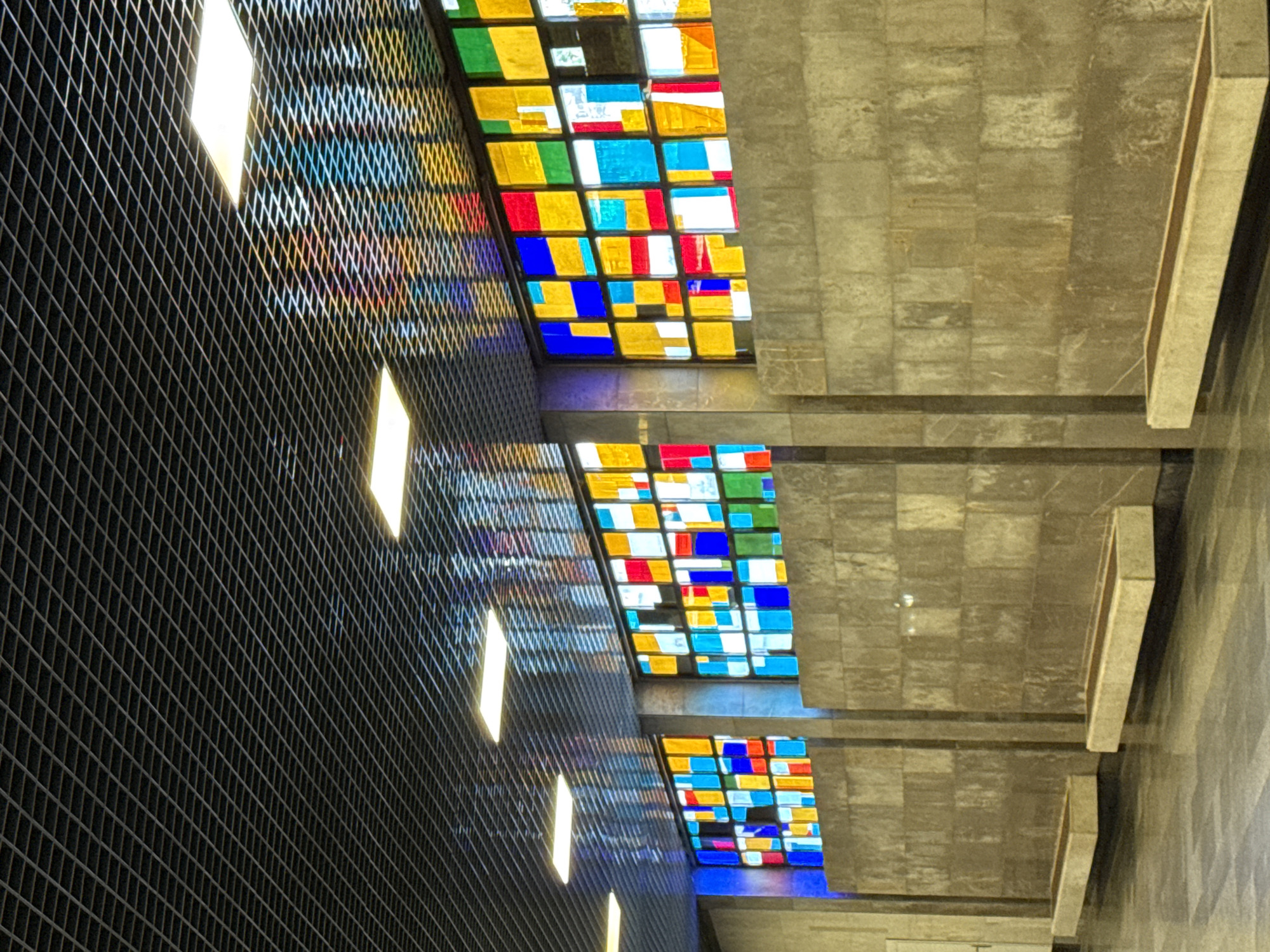 Inside New Athos: station platforms, ornate interiors, resting dog