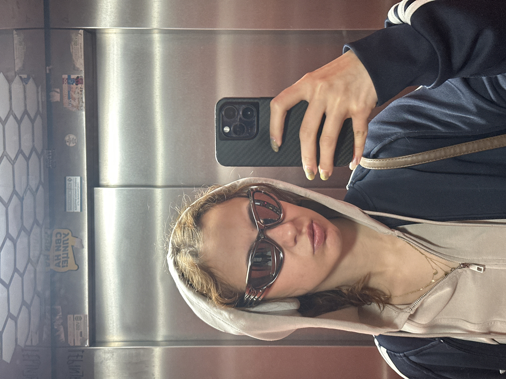 Woman takes morning selfies in Novi Sad elevator