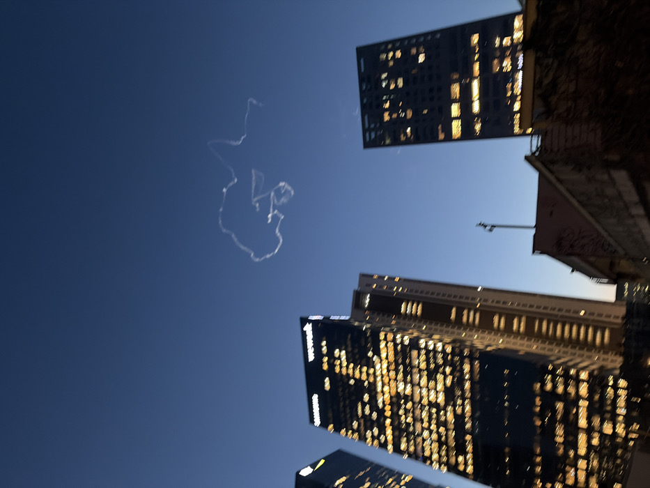 Aircraft contrail spotted over Tel Aviv twilight skyline