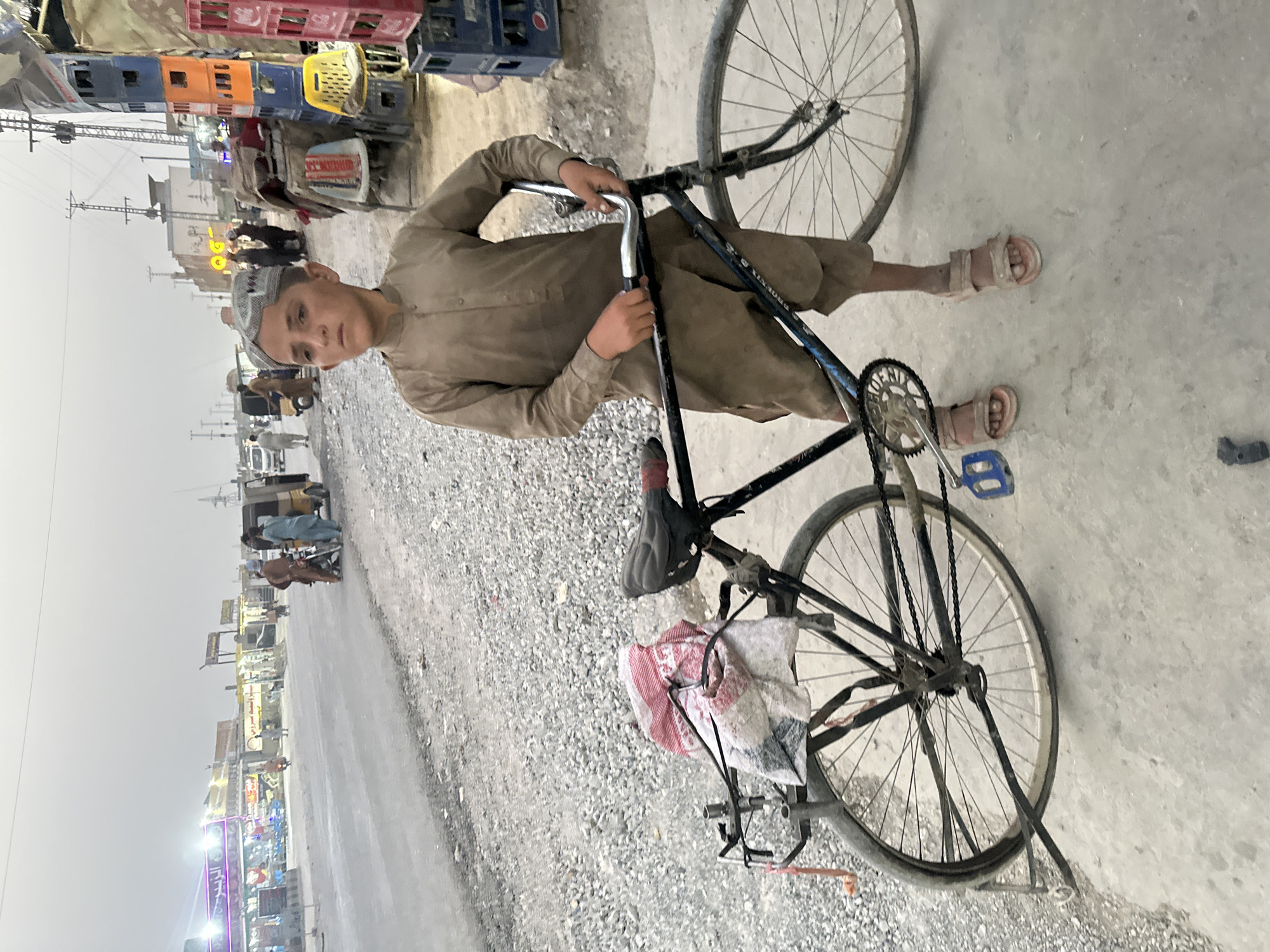 Roadside bike and motorcycle repairs on a Quetta street.