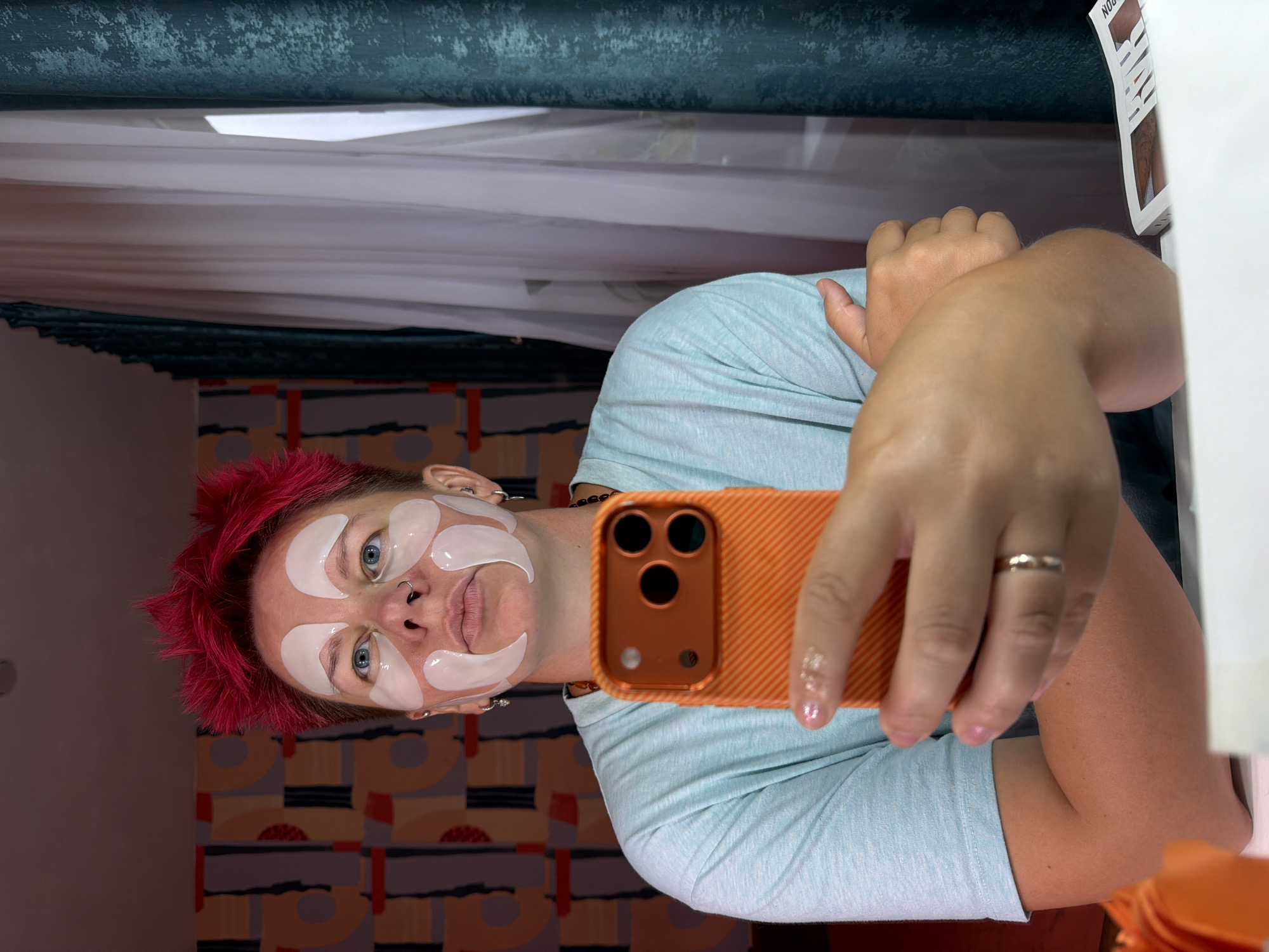 Skincare routine and selfies on an orange bed, Chaikovsky