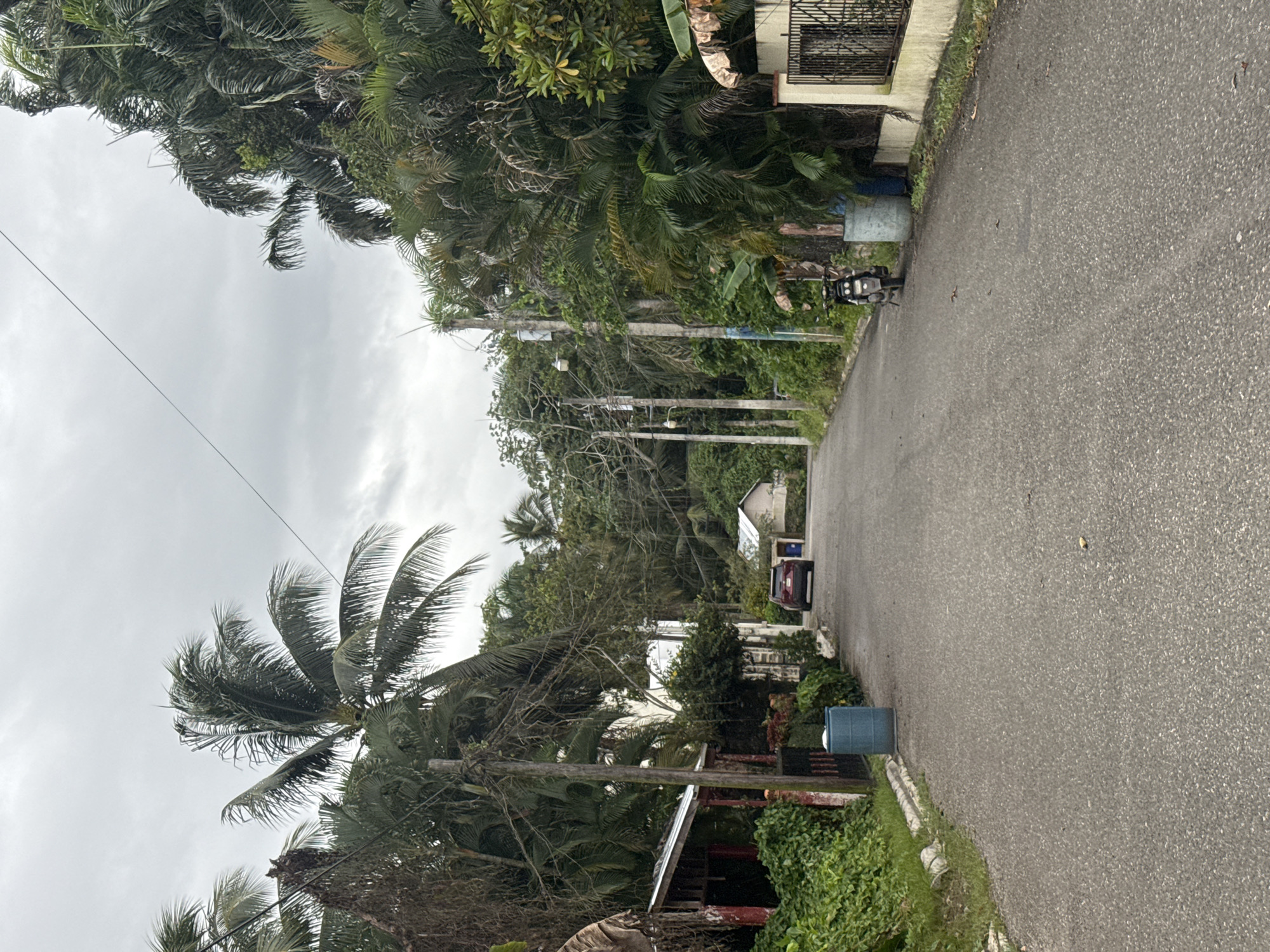 Street scene captured in Cabarete with red SUV