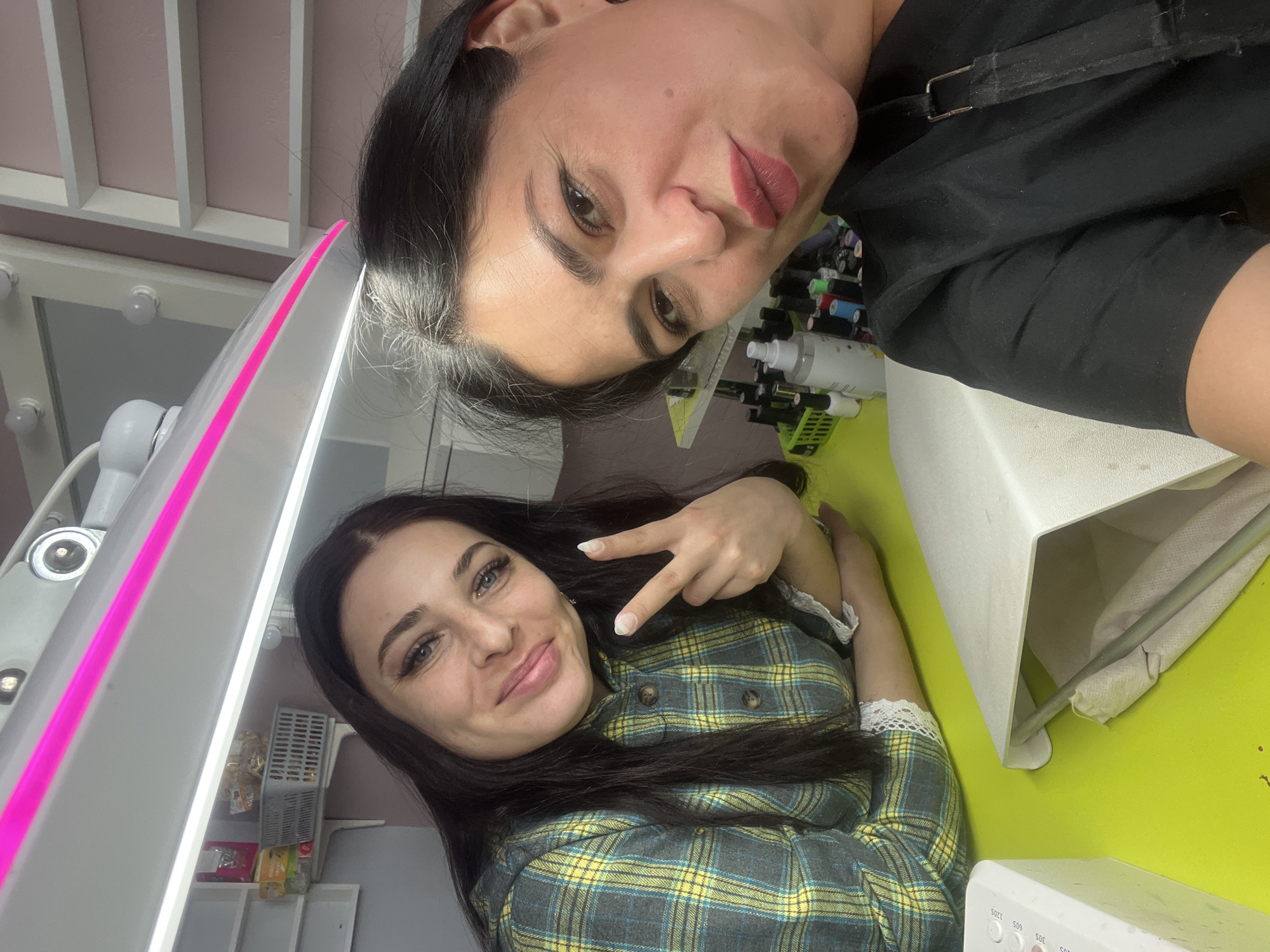 Women pose playfully at beauty salon in Chaikovsky