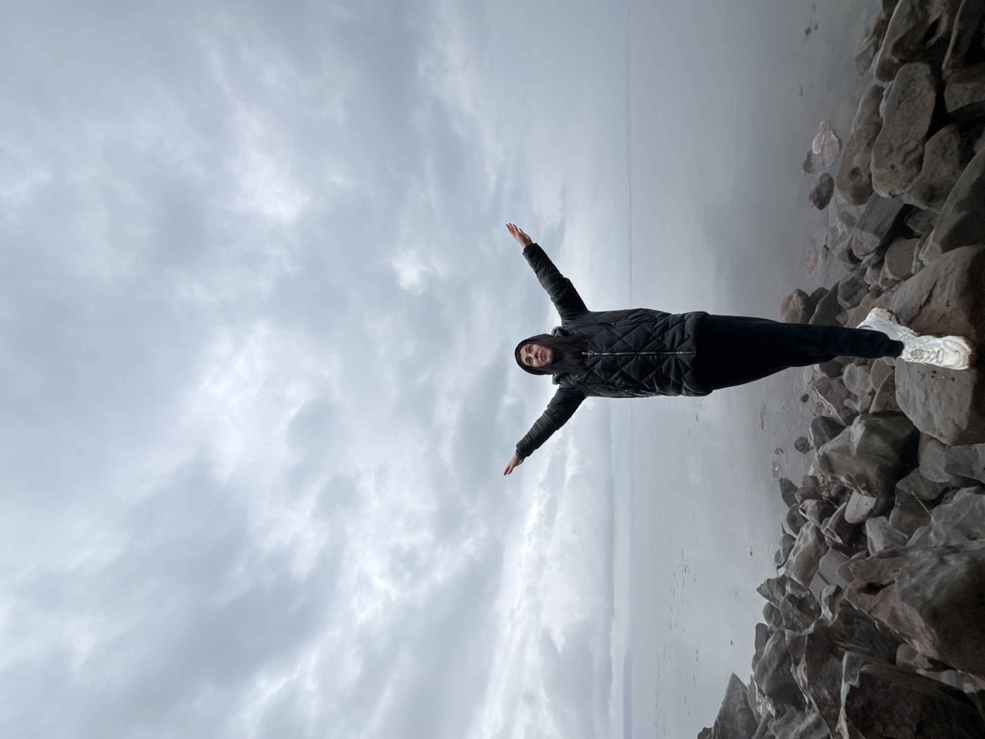 Two women explore rocky shores and forests near Kostovaty