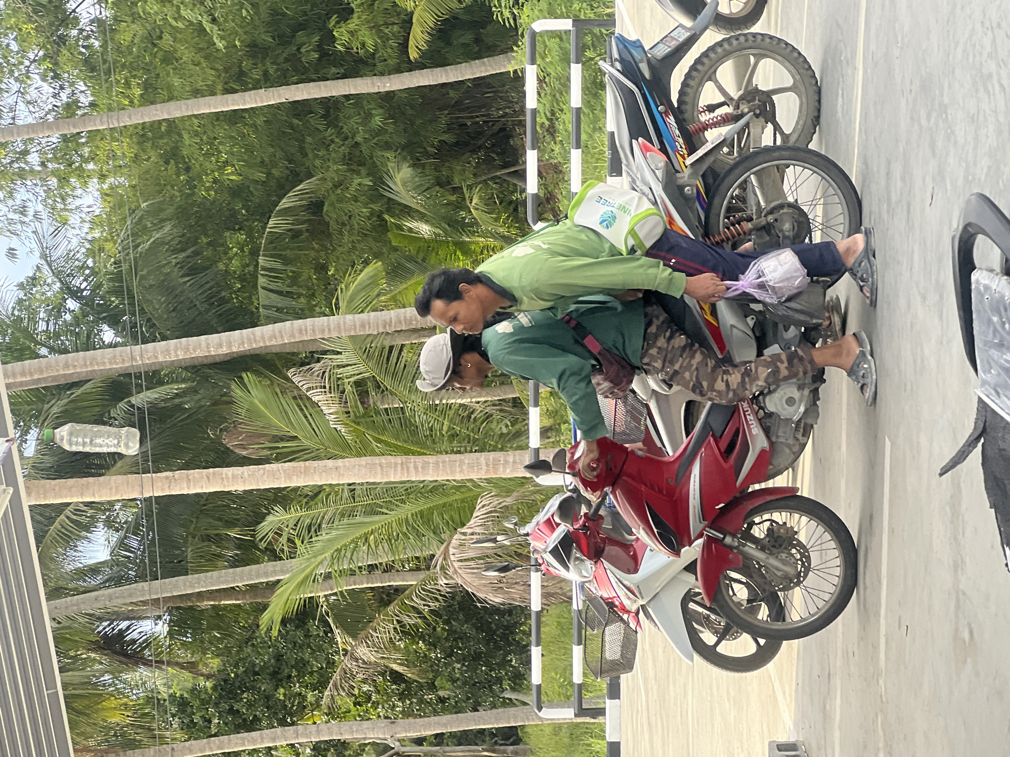 Motorcycles, locals, and street activity in Ko Pha-ngan