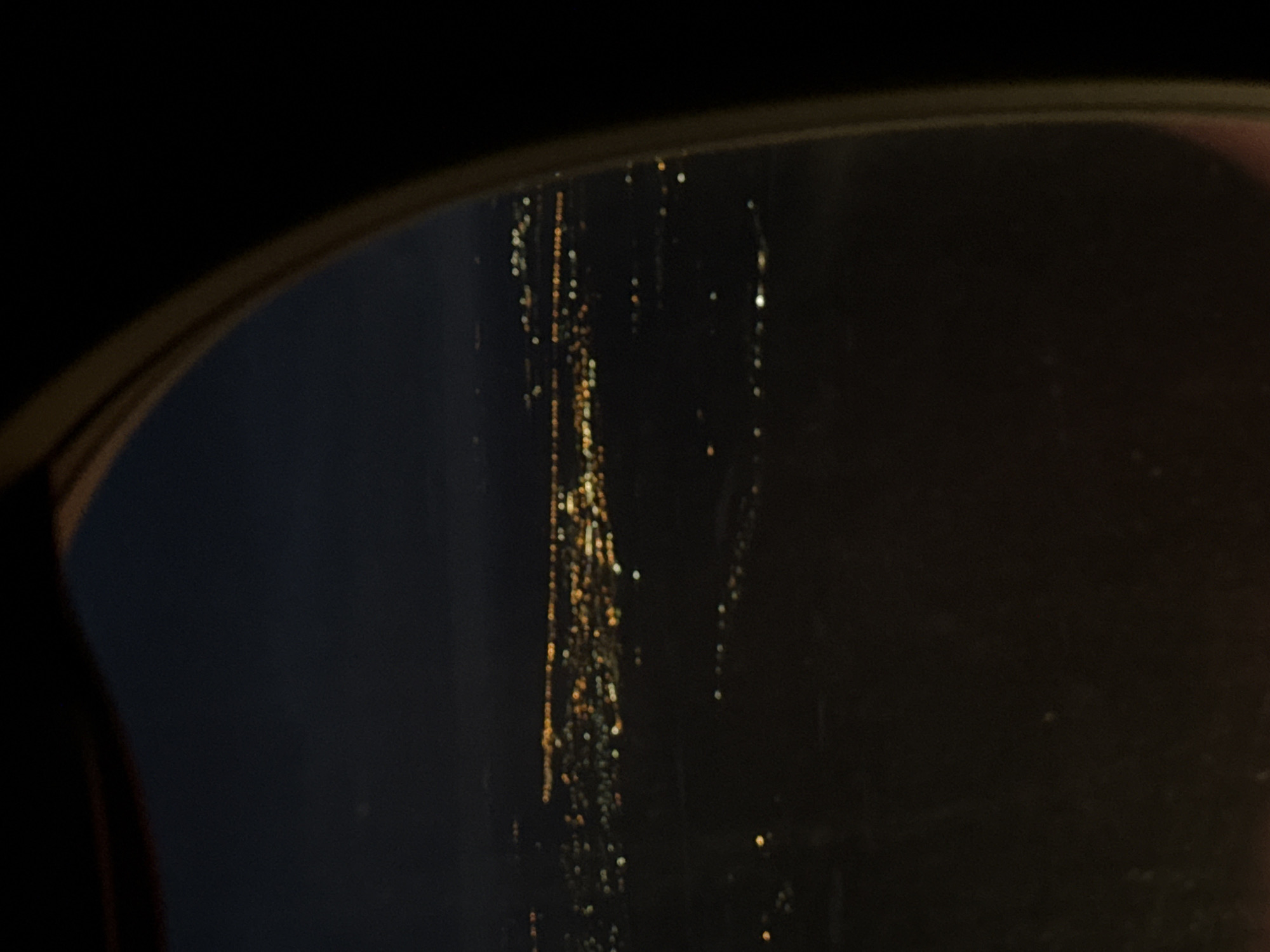 Nighttime city lights observed through window in Lobanovo, Russia