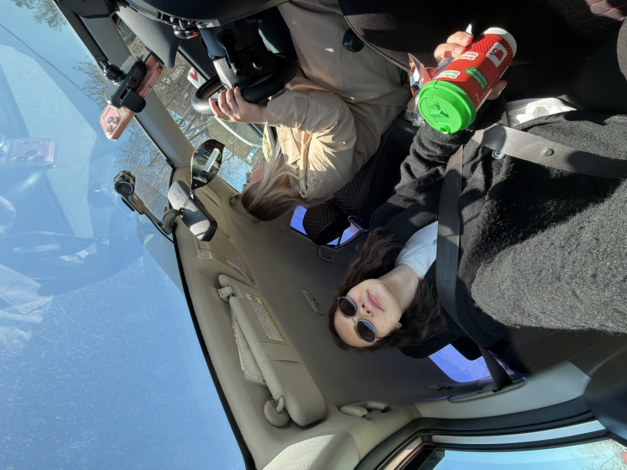 Car interior photographed in Chaikovsky showing two passengers