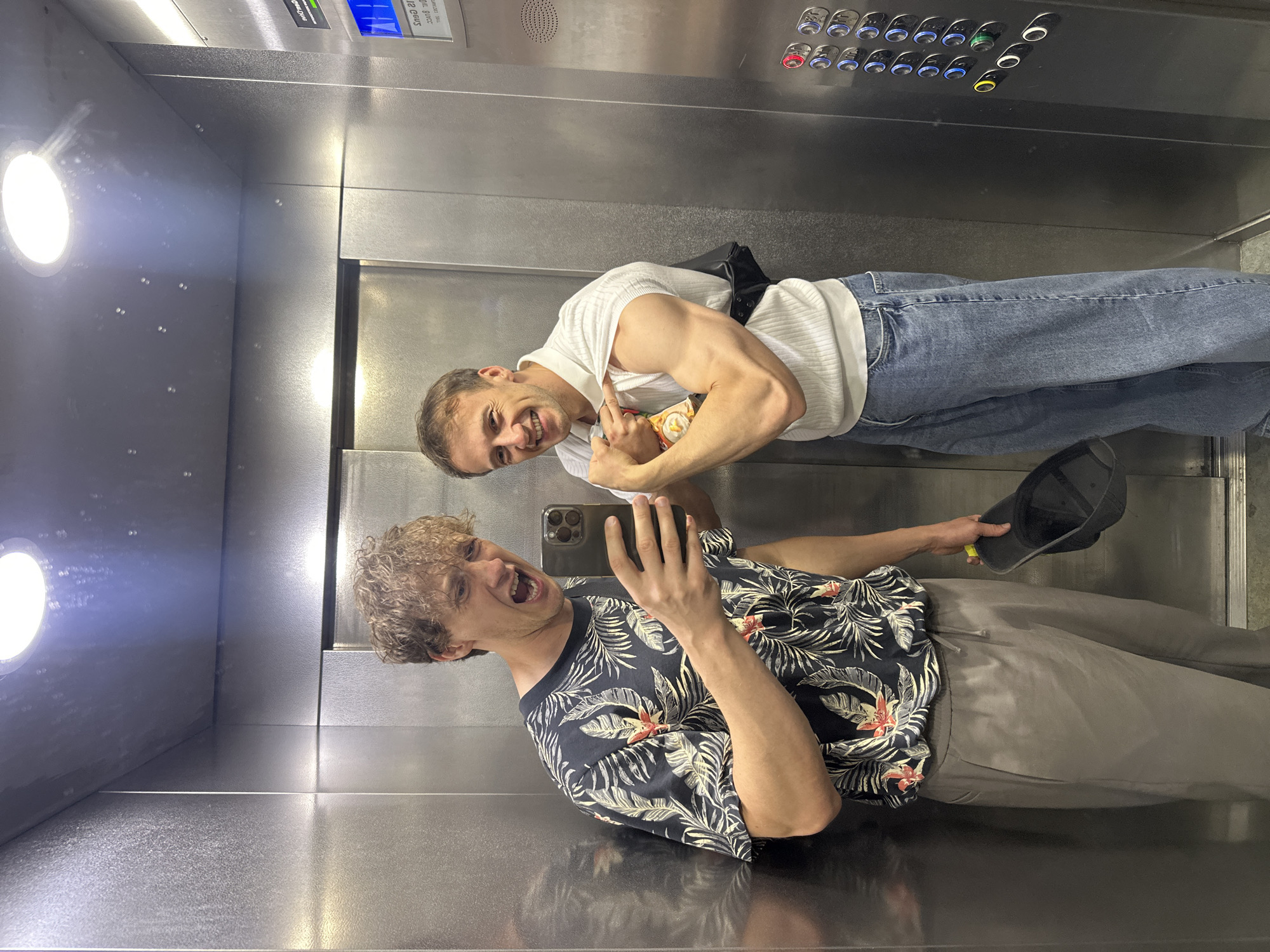 Elevator selfies in Russia, floral shirt and stainless steel walls
