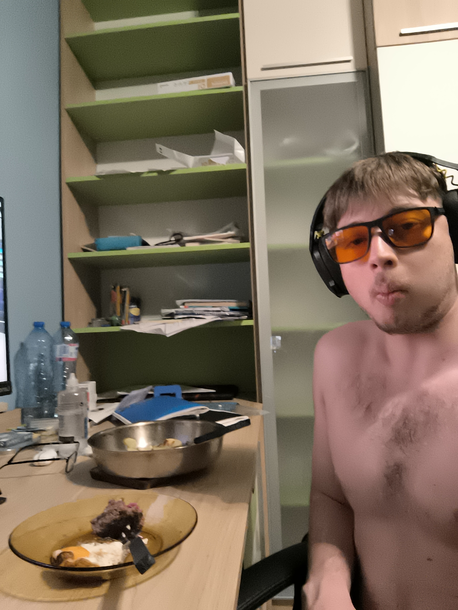 Man with headphones photographed in bedroom in Sofia